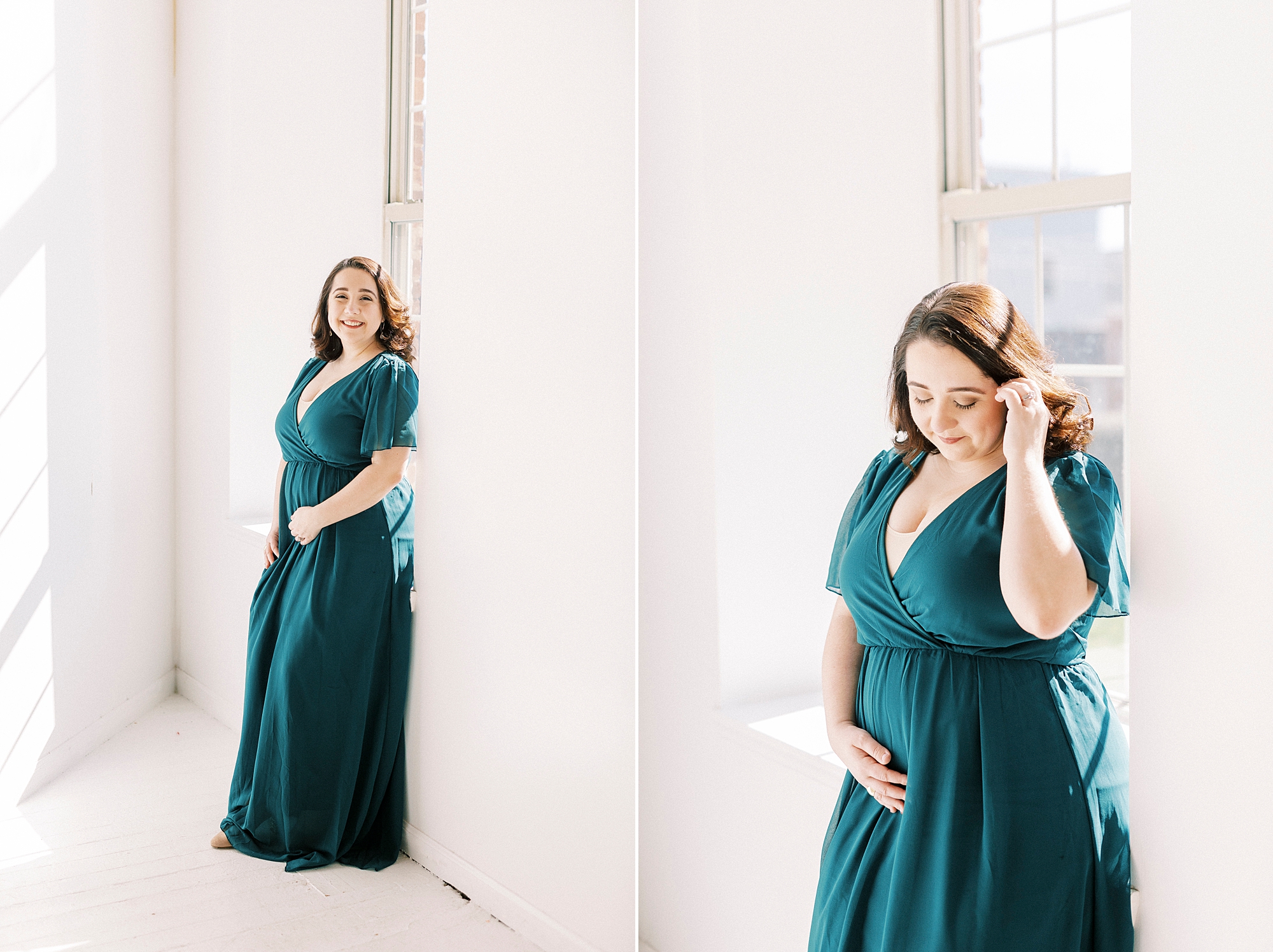 woman in teal gown holds baby bump in Concord NC studio 