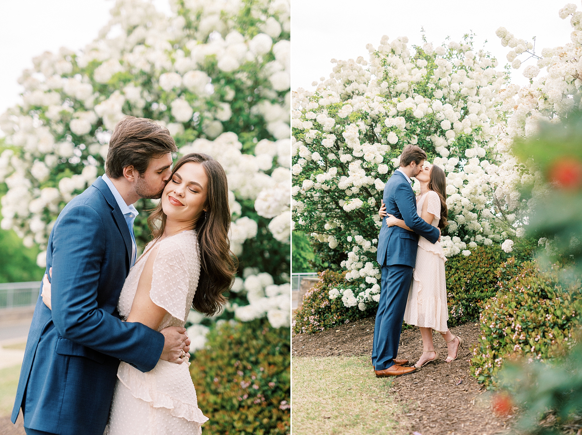 groom leans to kiss woman's cheek by white bush