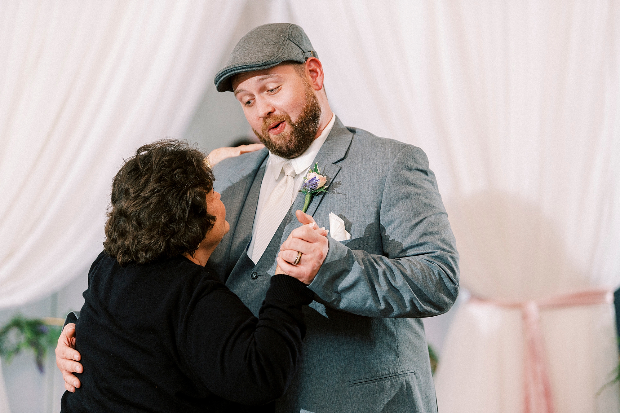 groom dances with mom during Charlotte NC wedding reception 