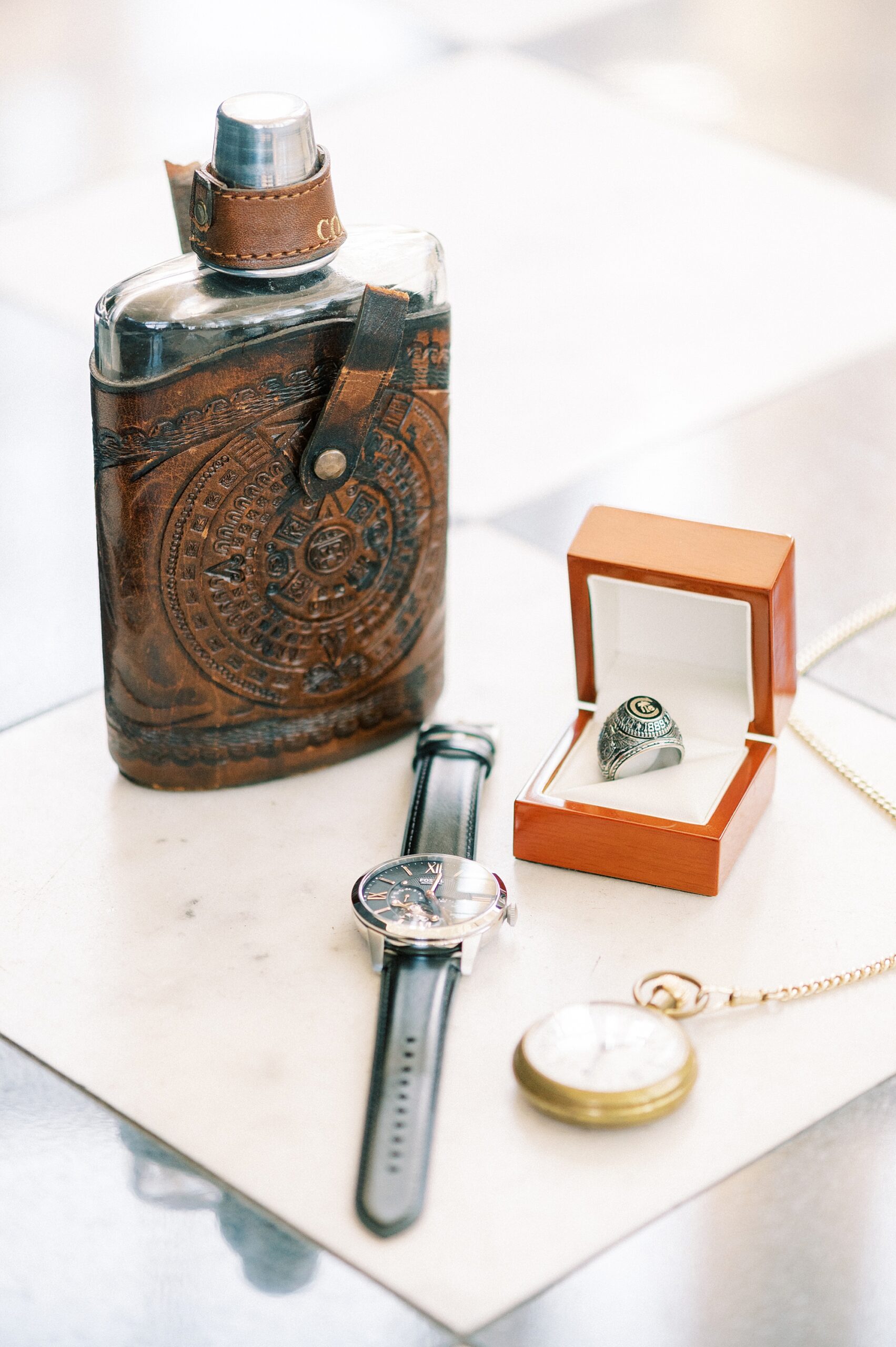 groom's watch, pocket watch, and flask 