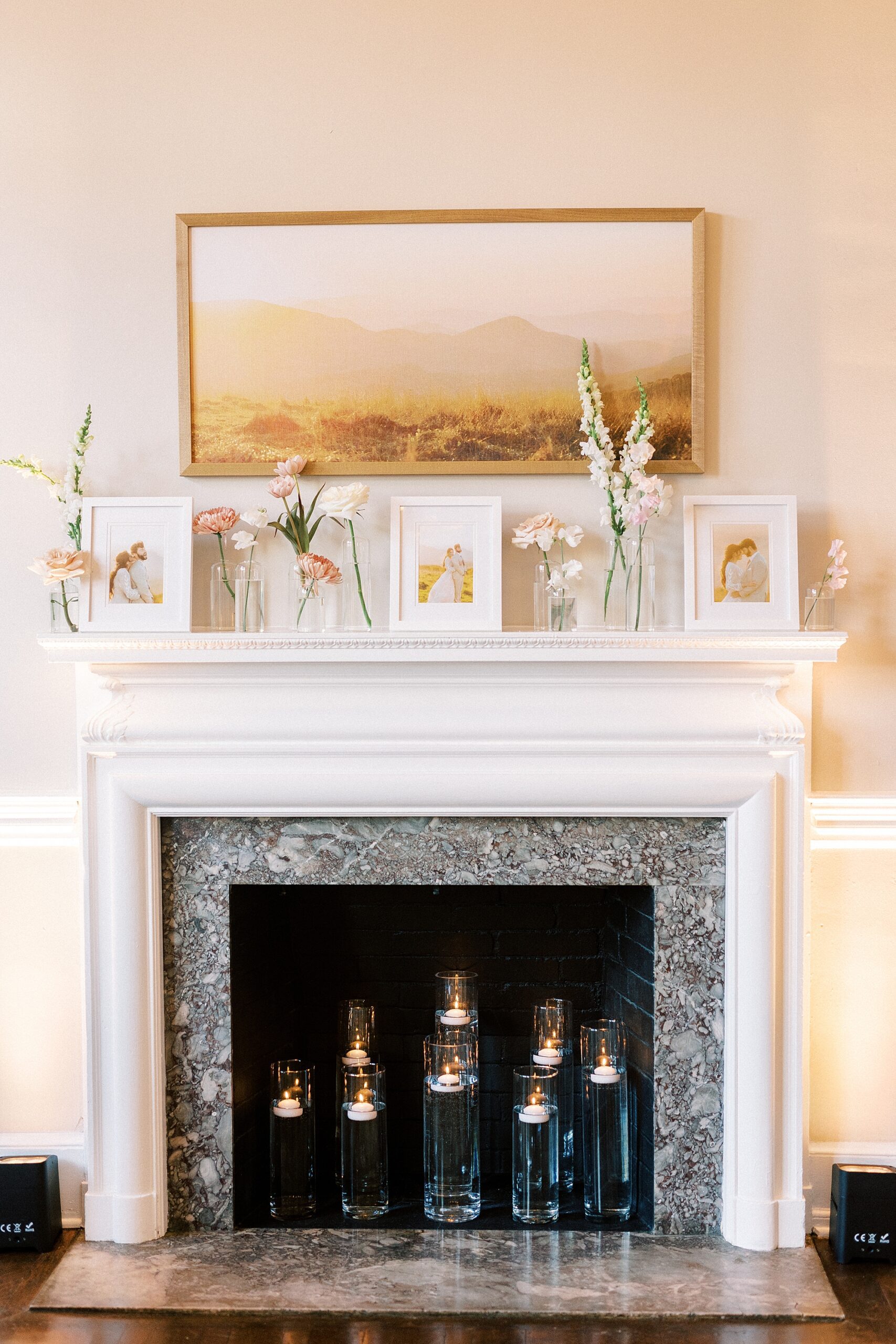 fireplace at Separk Mansion with photos and simple floral displays 