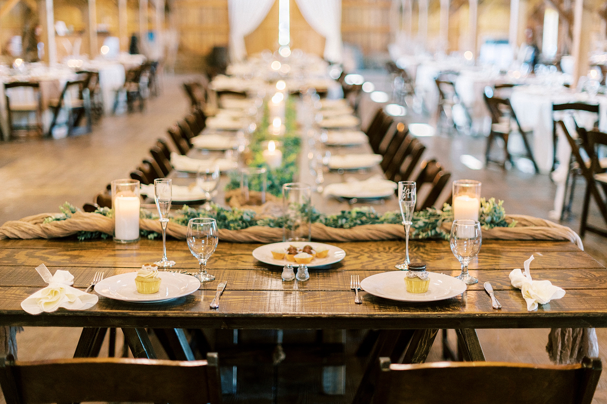 wedding reception with burlap and greenery at The Farmstead