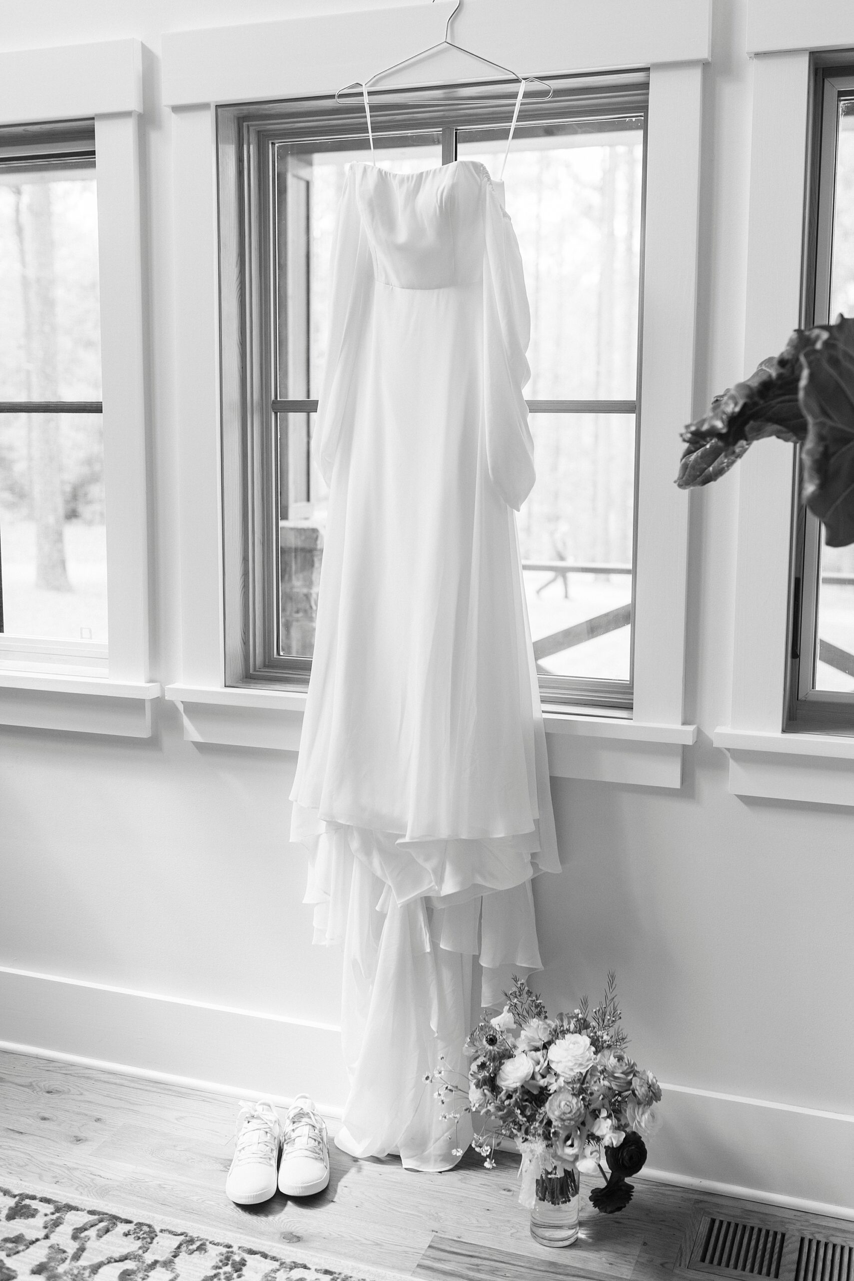 wedding dress hangs in window of Ritchfield NC home