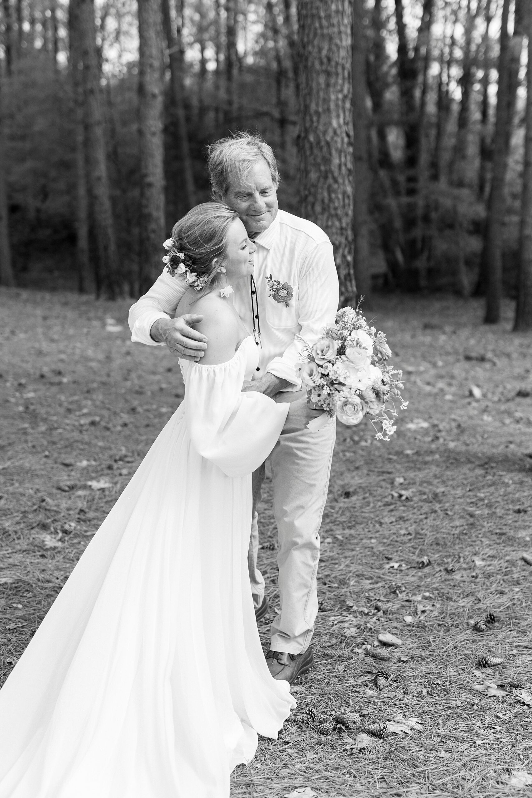 bride and father hug during first look on property in Richfield NC