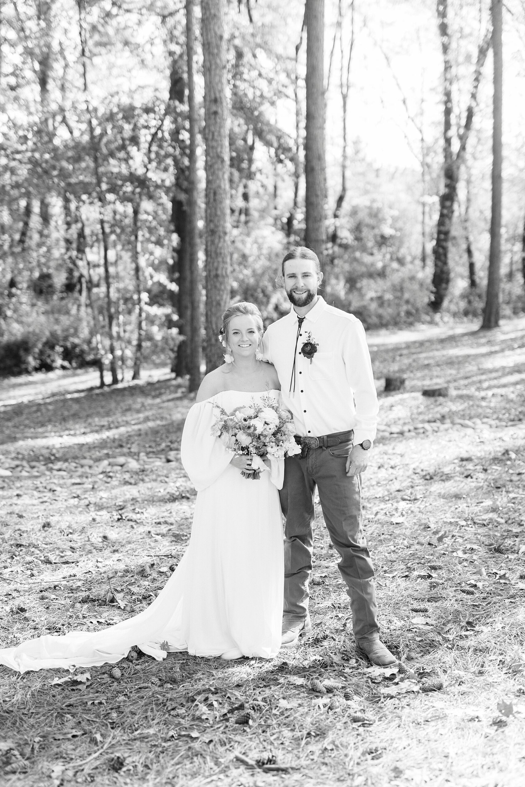 bride and groom hug on hill near Richfield NC home