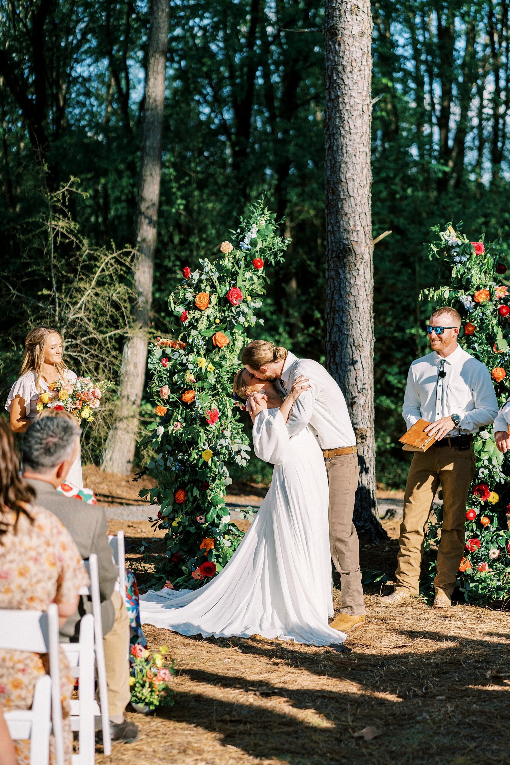 first kiss during wedding ceremony on lawn of Richfield NC home