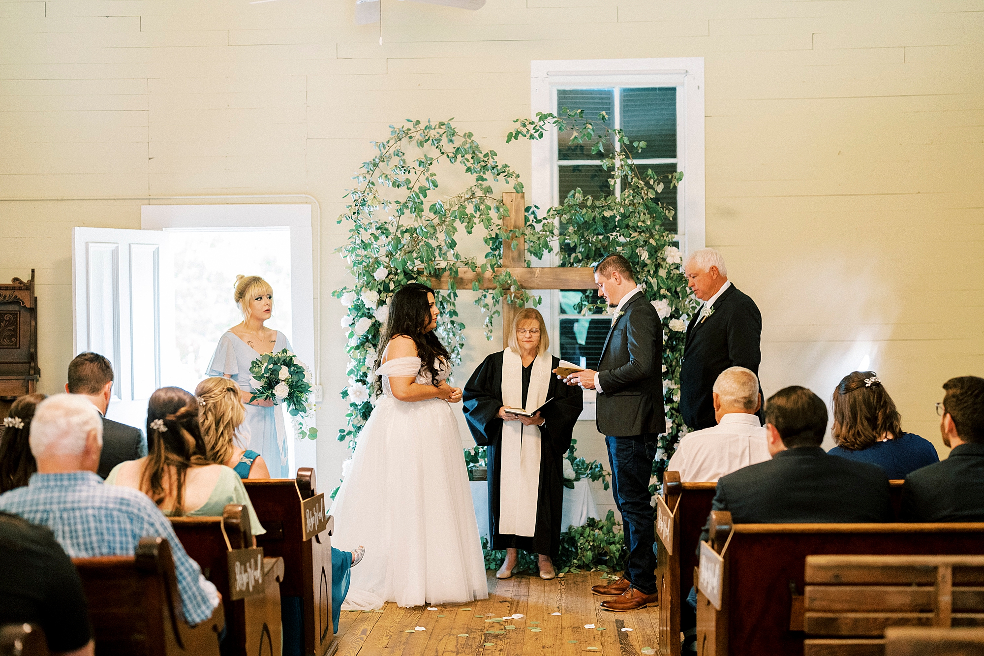 newlyweds read vows during wedding ceremony at Troutman Historical Cemetery chapel
