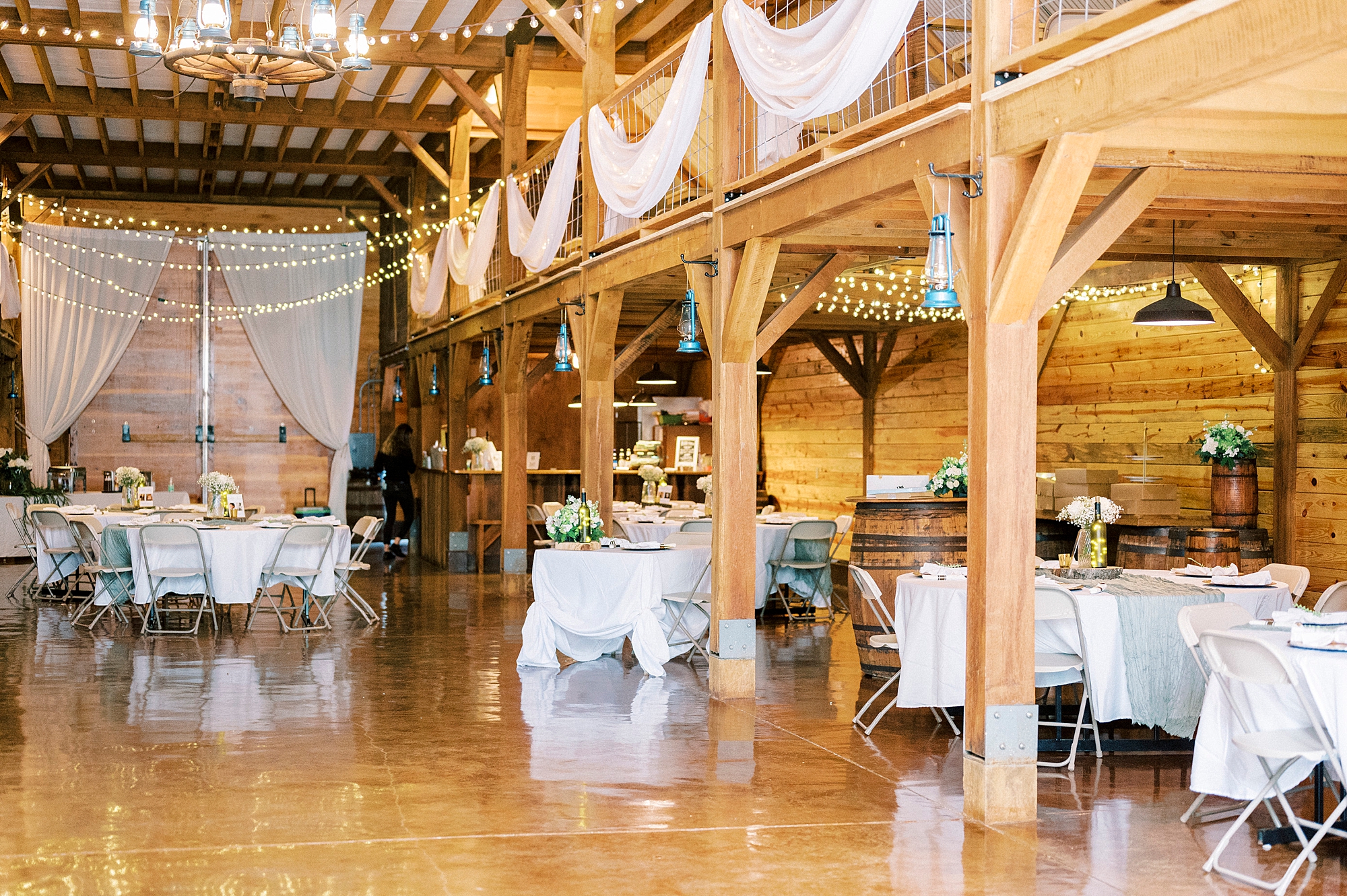 wedding reception with rustic details in barn at Danner Farms
