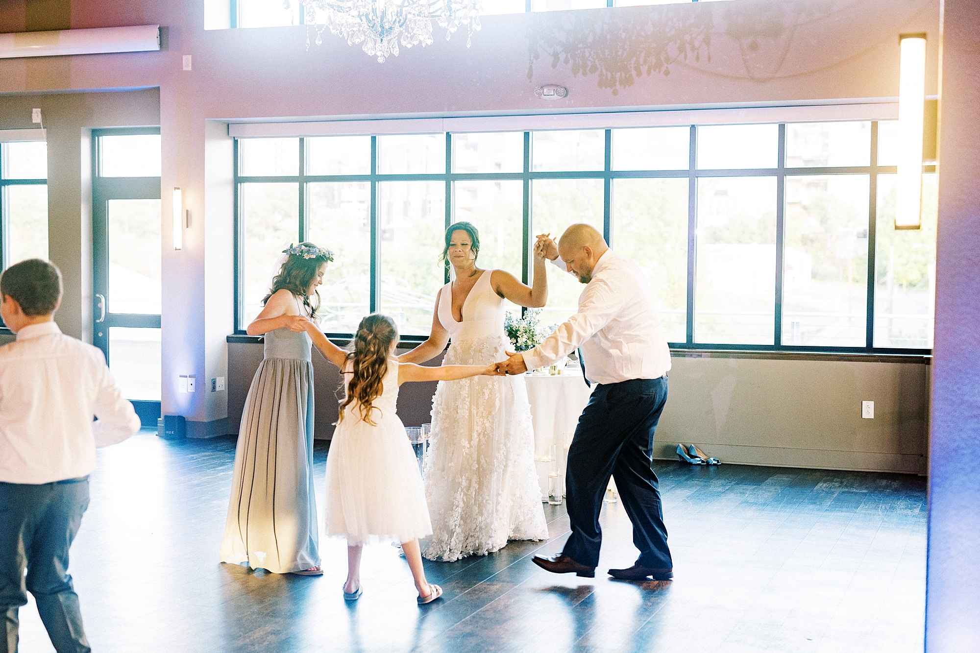 bride and groom dance with daughters during wedding at the Terrace at Cedar Hill
