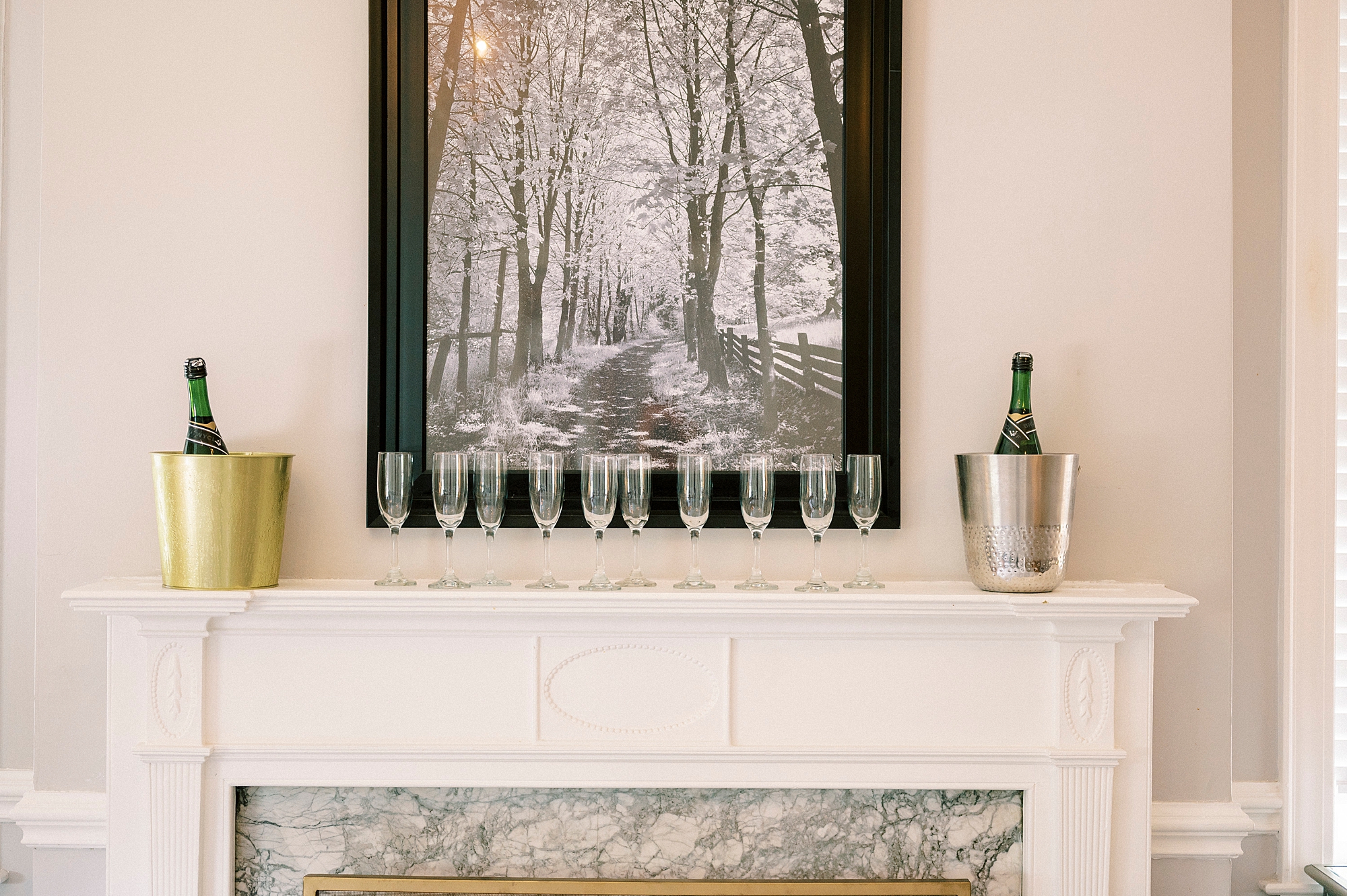 champagne sits on mantle of fireplace at Separk Mansion