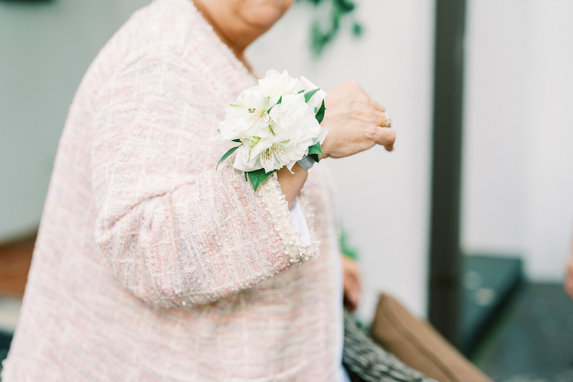simple white corsage for grandmother for summer wedding