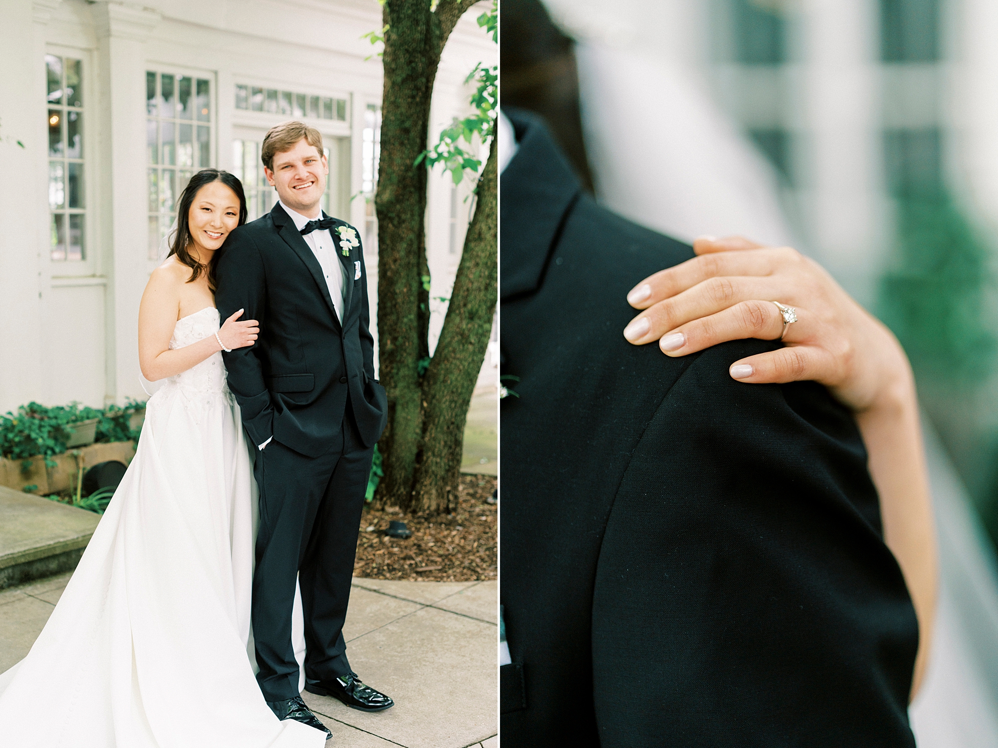 bride holds groom's shoulder in black suit showing off ring