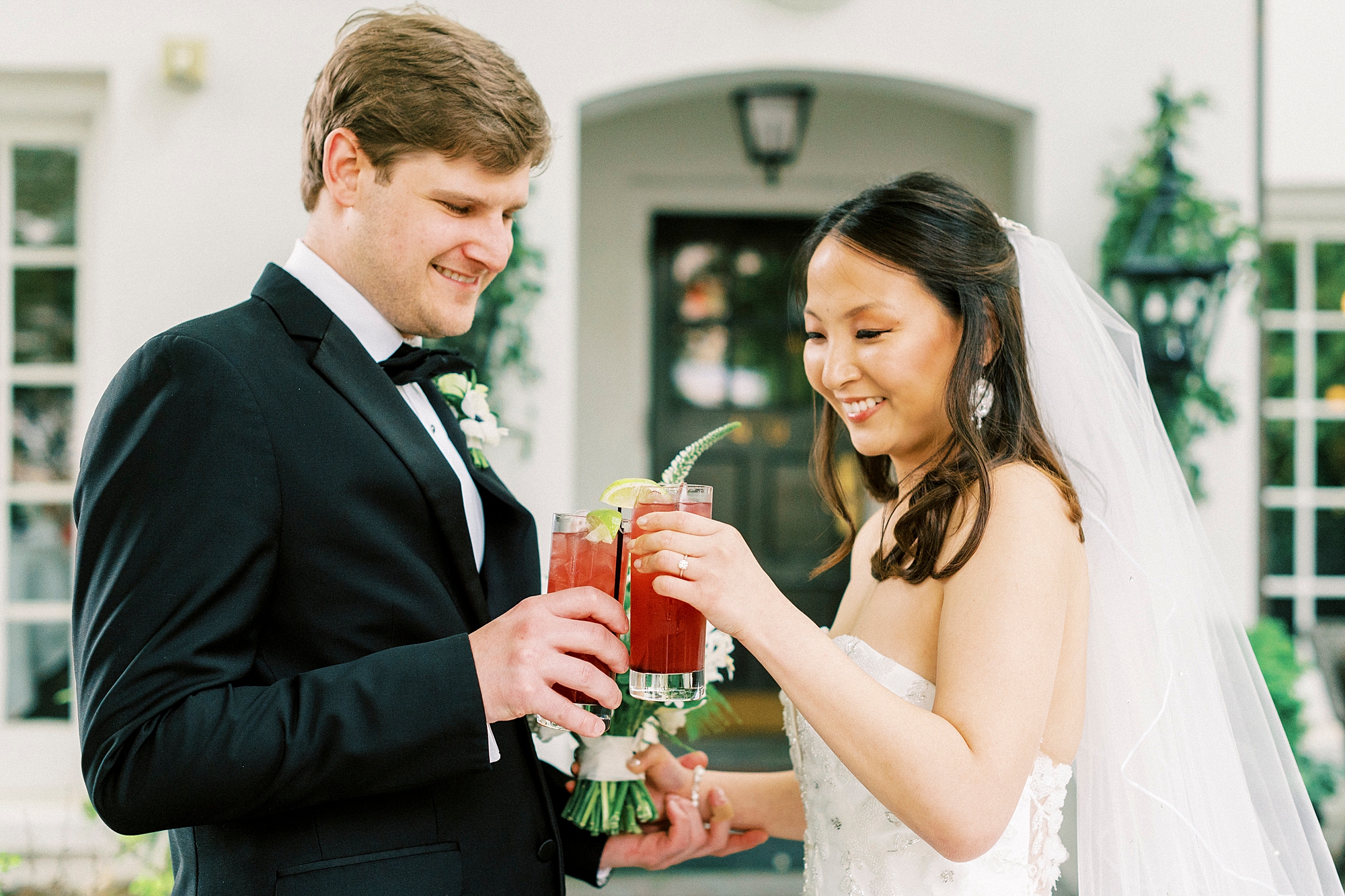 bride and groom toast with custom cocktails 