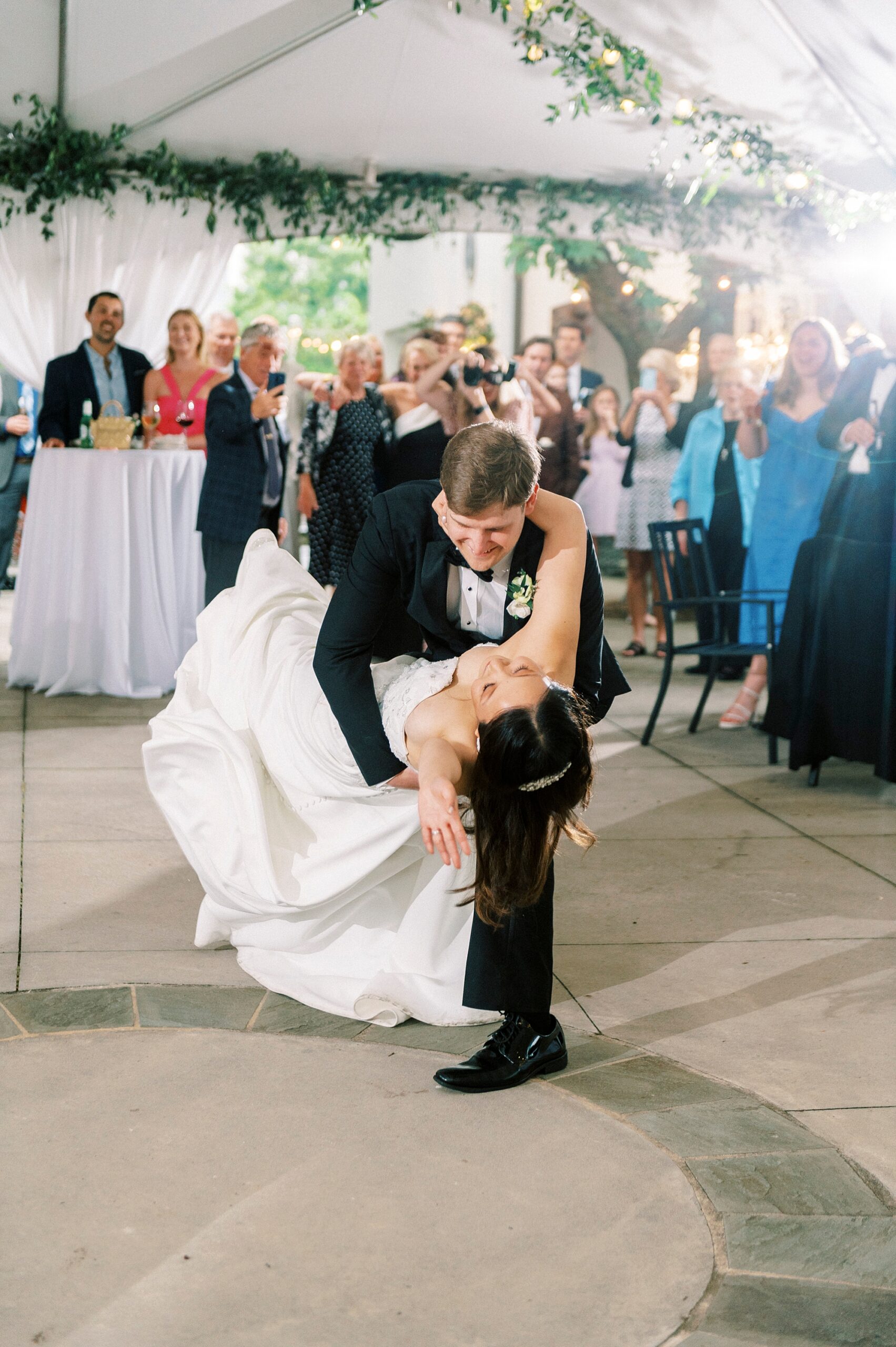 groom dips bride during first dance at The Spring House
