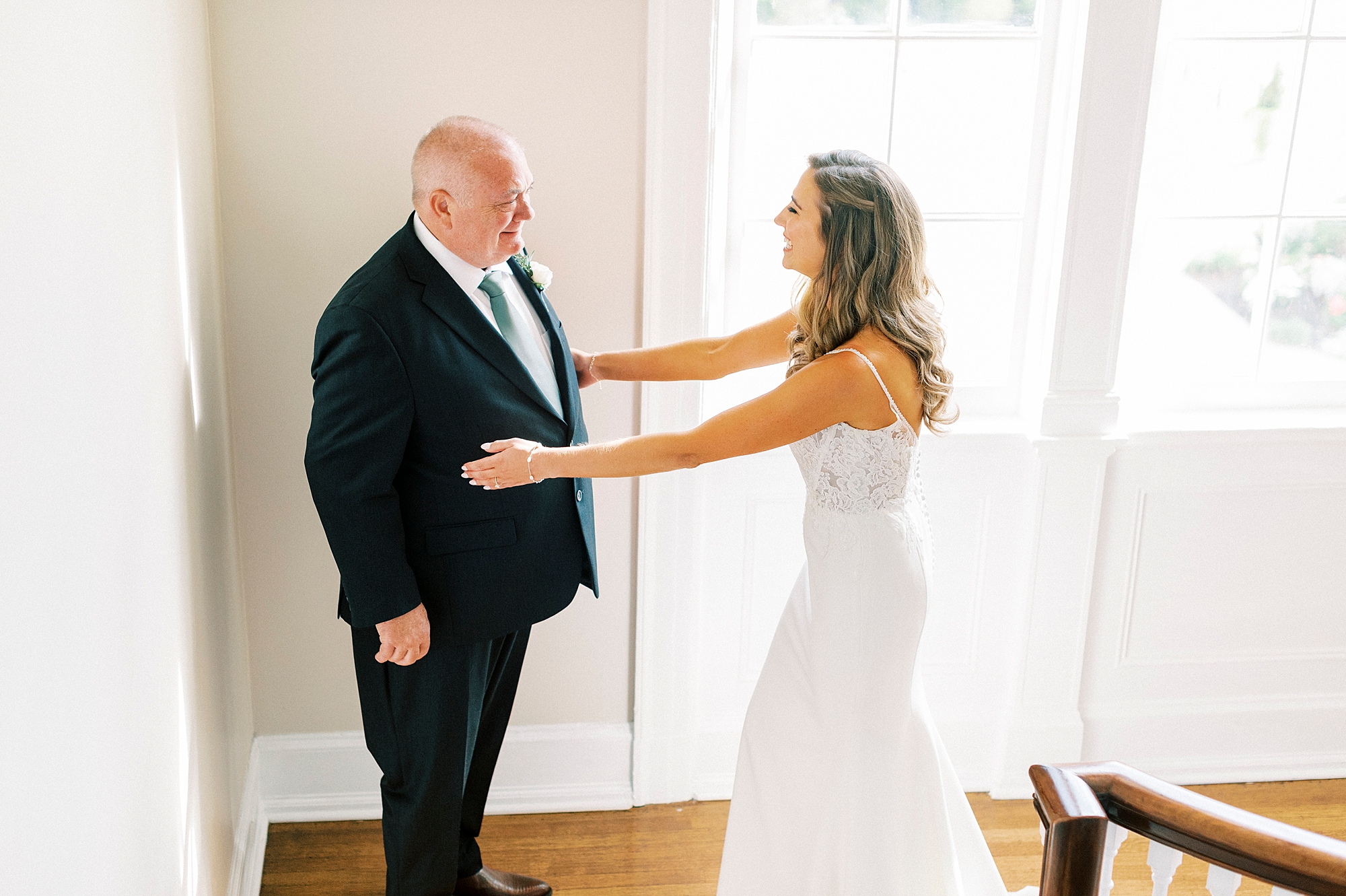 bride reaches for dad during first look inside Separk Mansion staircase 