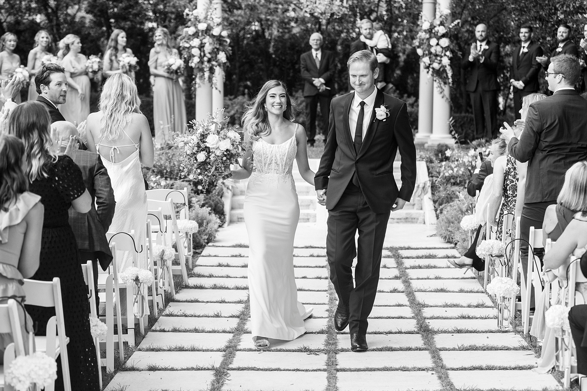 bride and groom walk up aisle after outdoor wedding ceremony at Separk Mansion