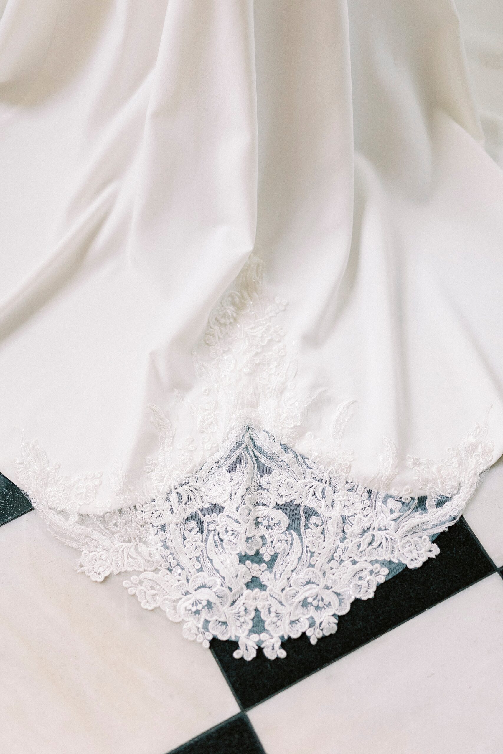 lace detailing on bottom of wedding gown 