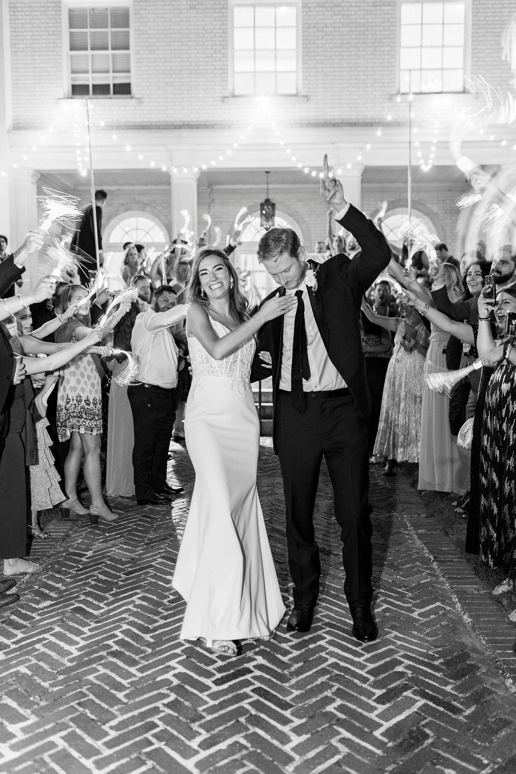 newlyweds cheer during sparkler exit outside Separk Mansion leaving NC wedding reception