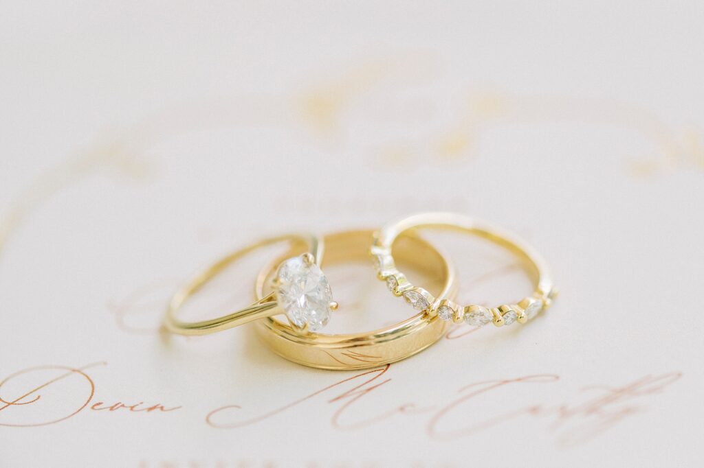 gold wedding bands with invitation suite