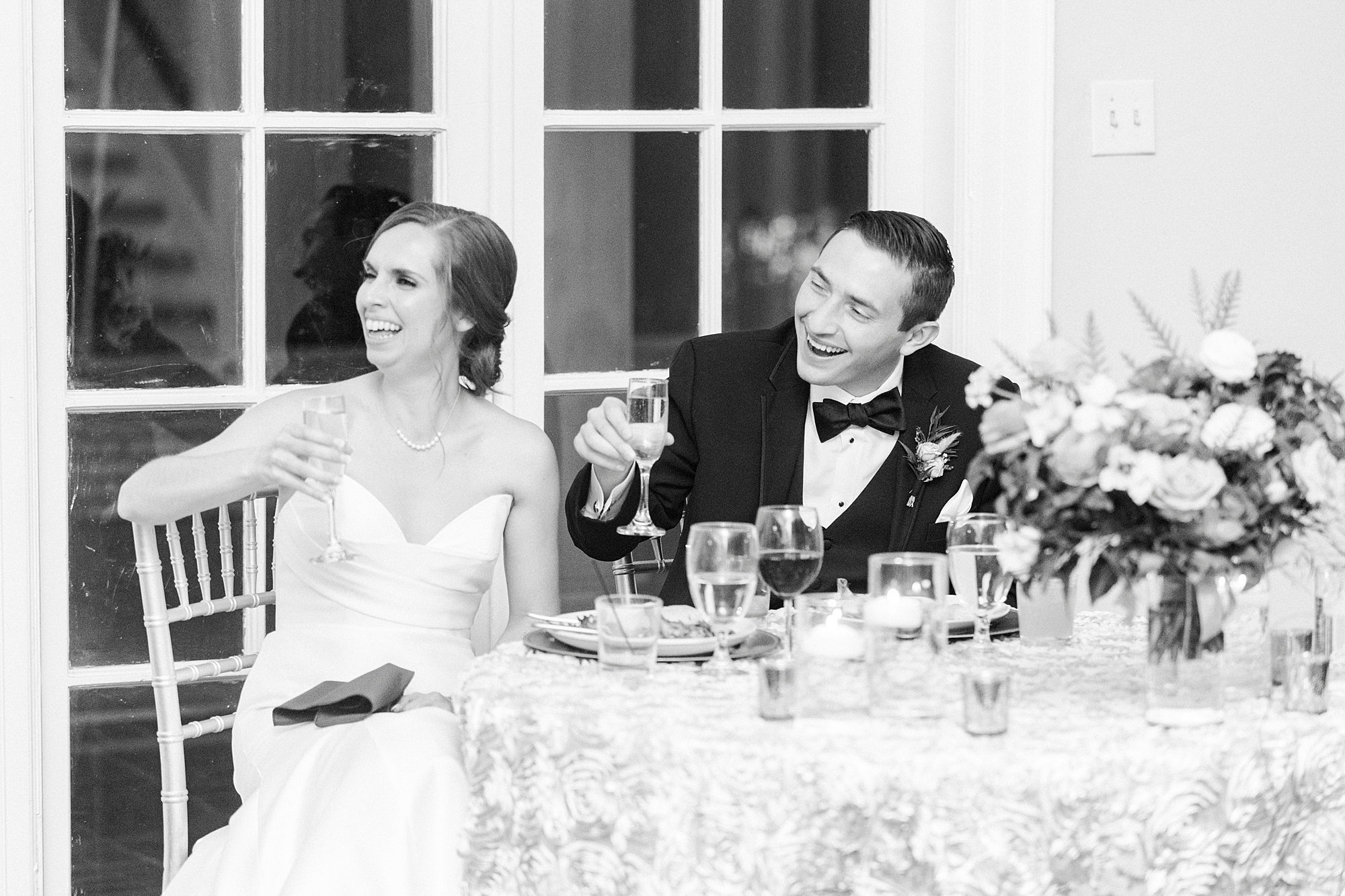 bride and groom laugh during toasts at Separk Mansion