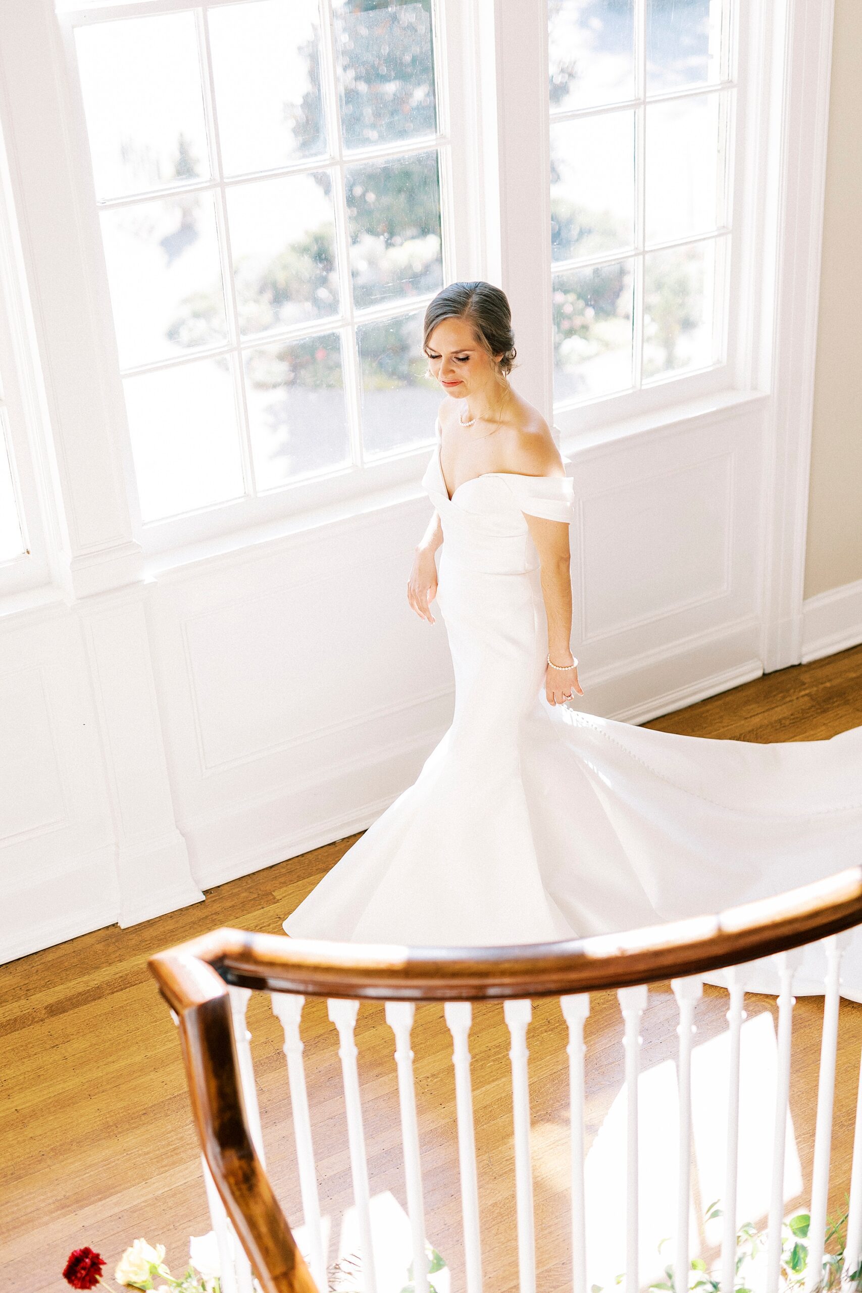bride walks down staircase inside Separk Mansion