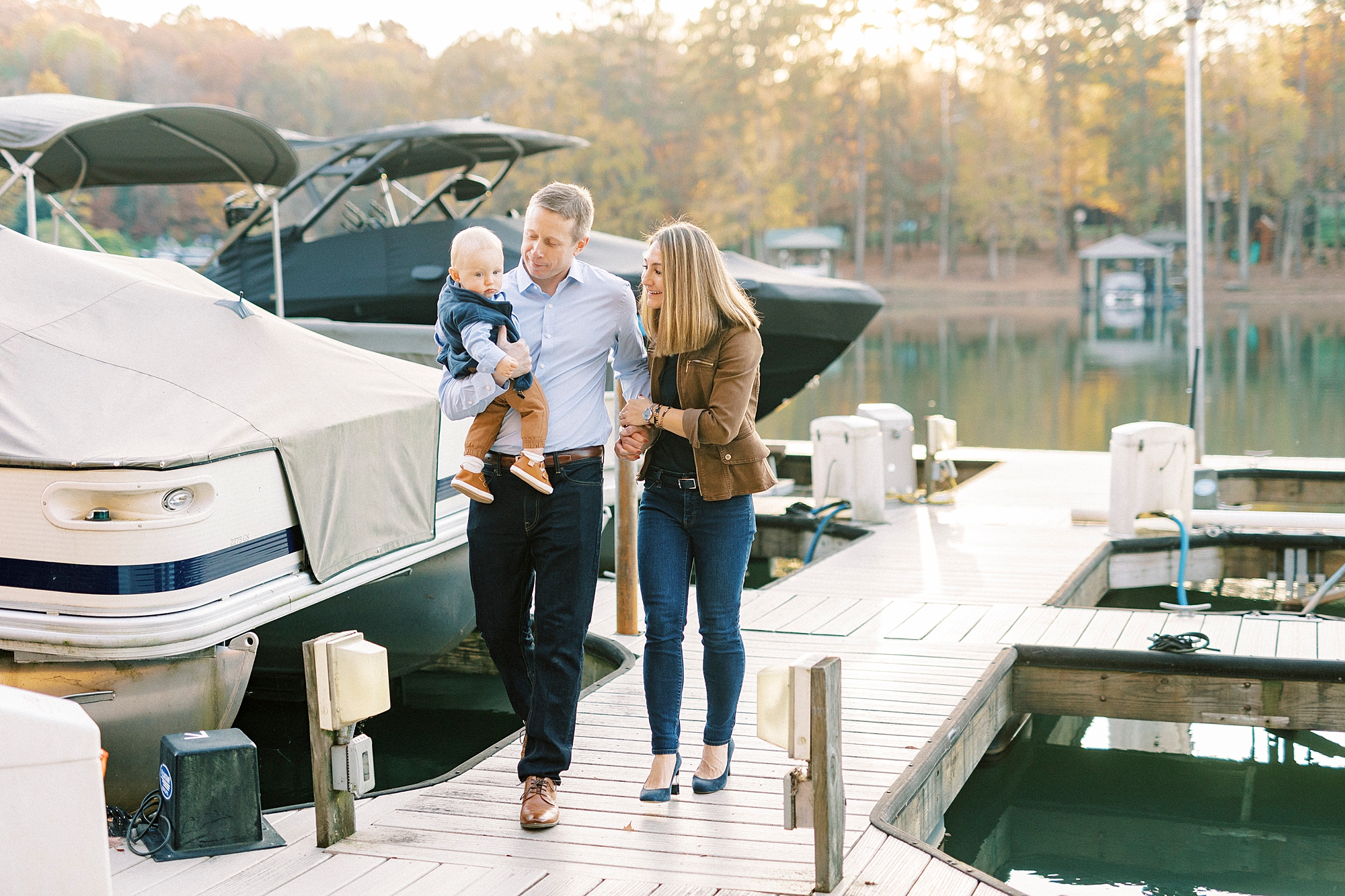 parents walk by boats in marina near home in Charlotte NC