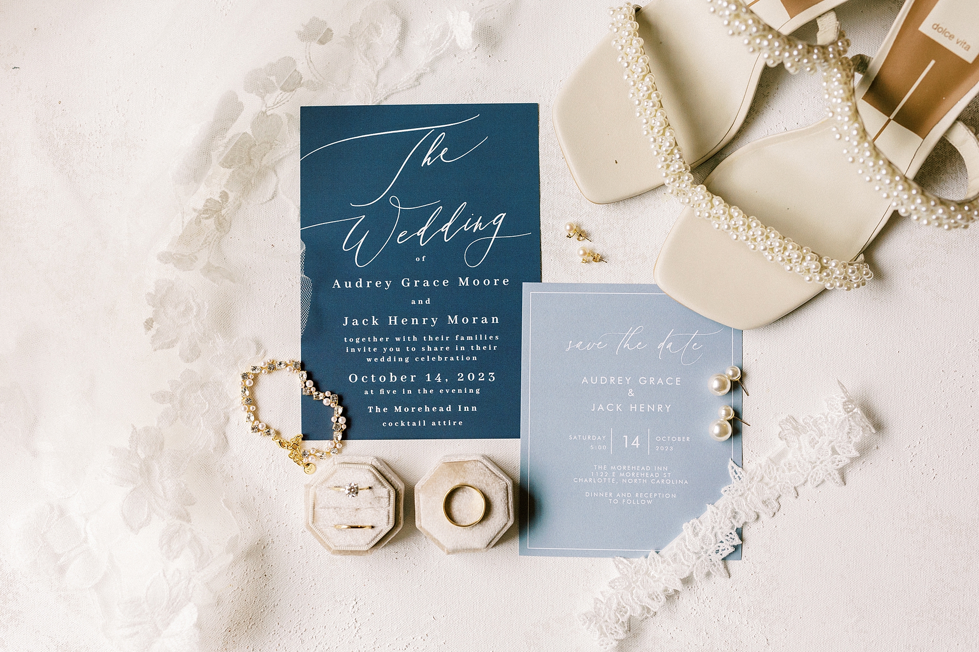 light blue stationery set and bride's jewelry for fall wedding at The Morehead Inn