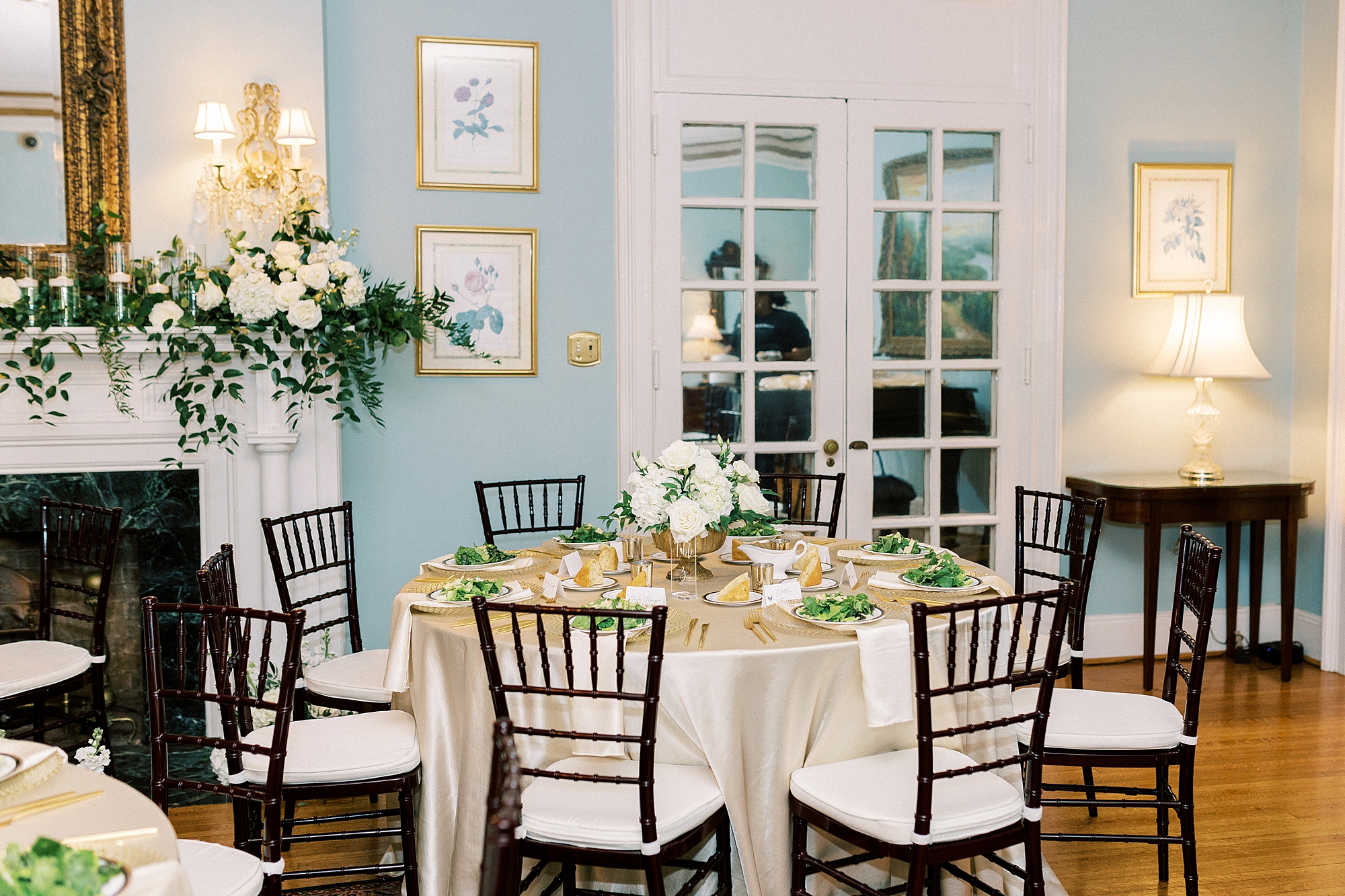 wedding reception at the Morehead Inn with dark chairs and light white table cloth 