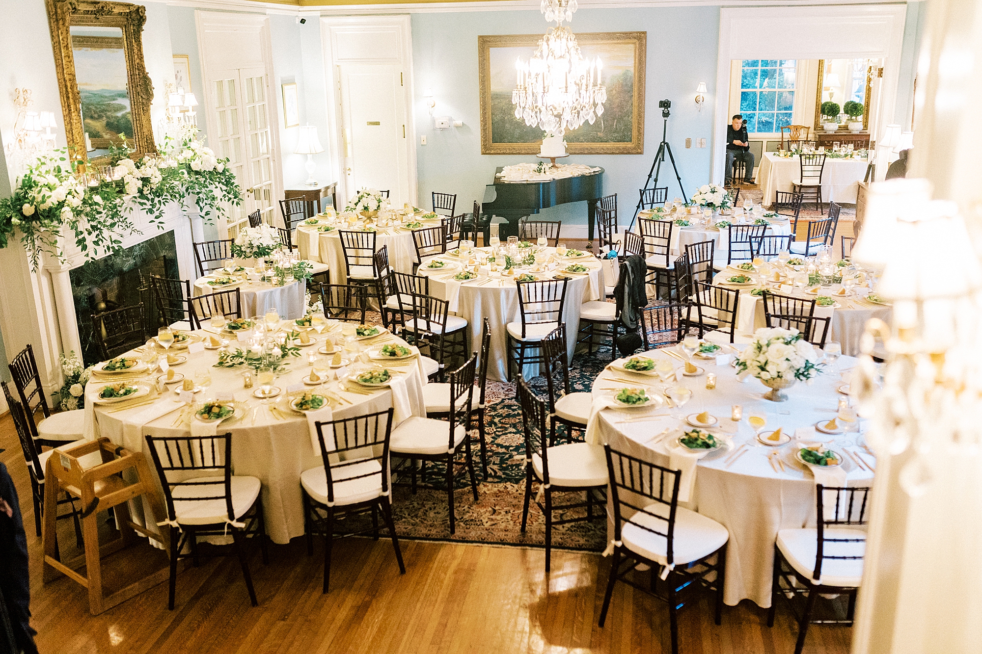 wedding reception at the Morehead Inn with gold candles, greenery, and salads 