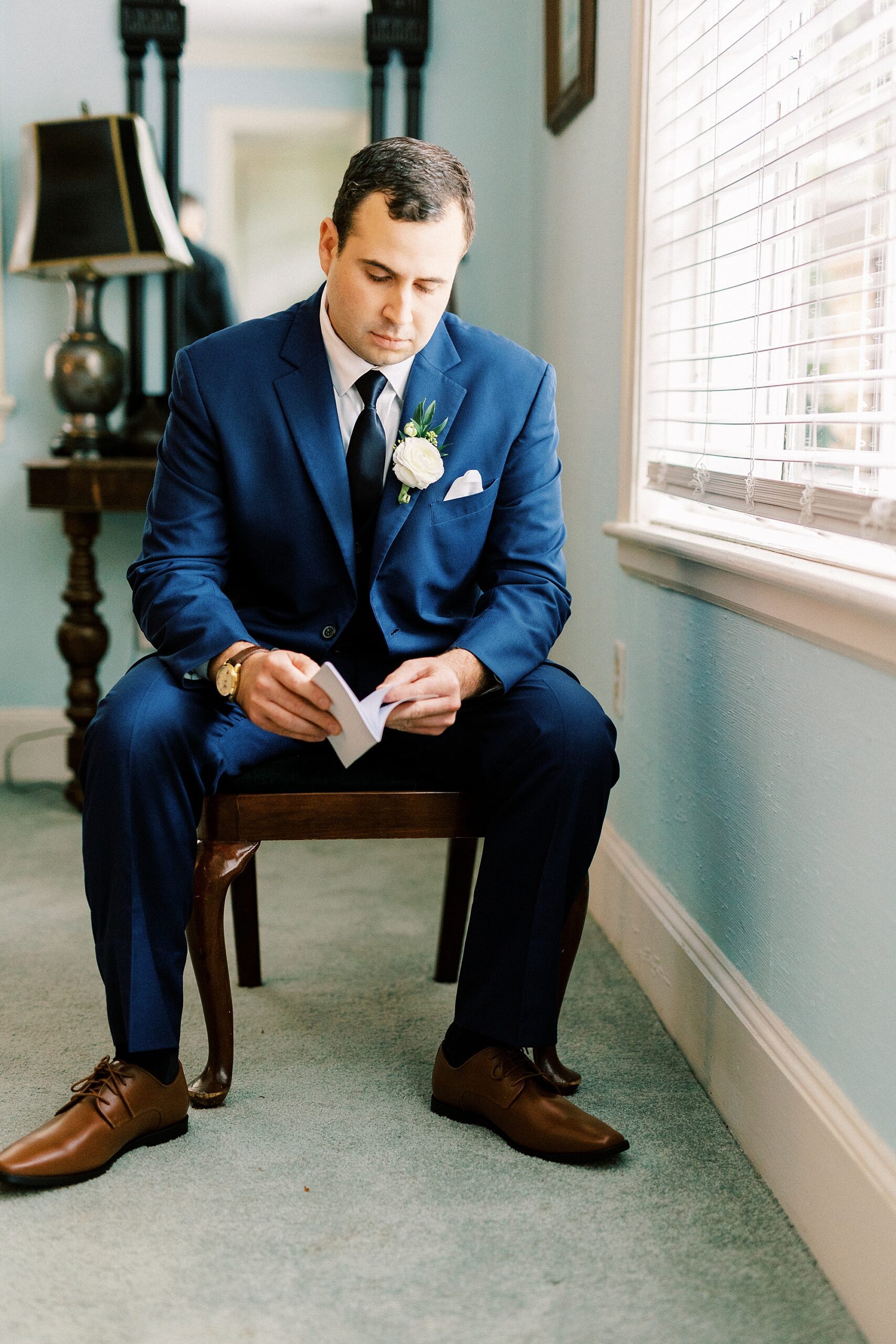 groom reads letter on wedding morning in Charlotte NC