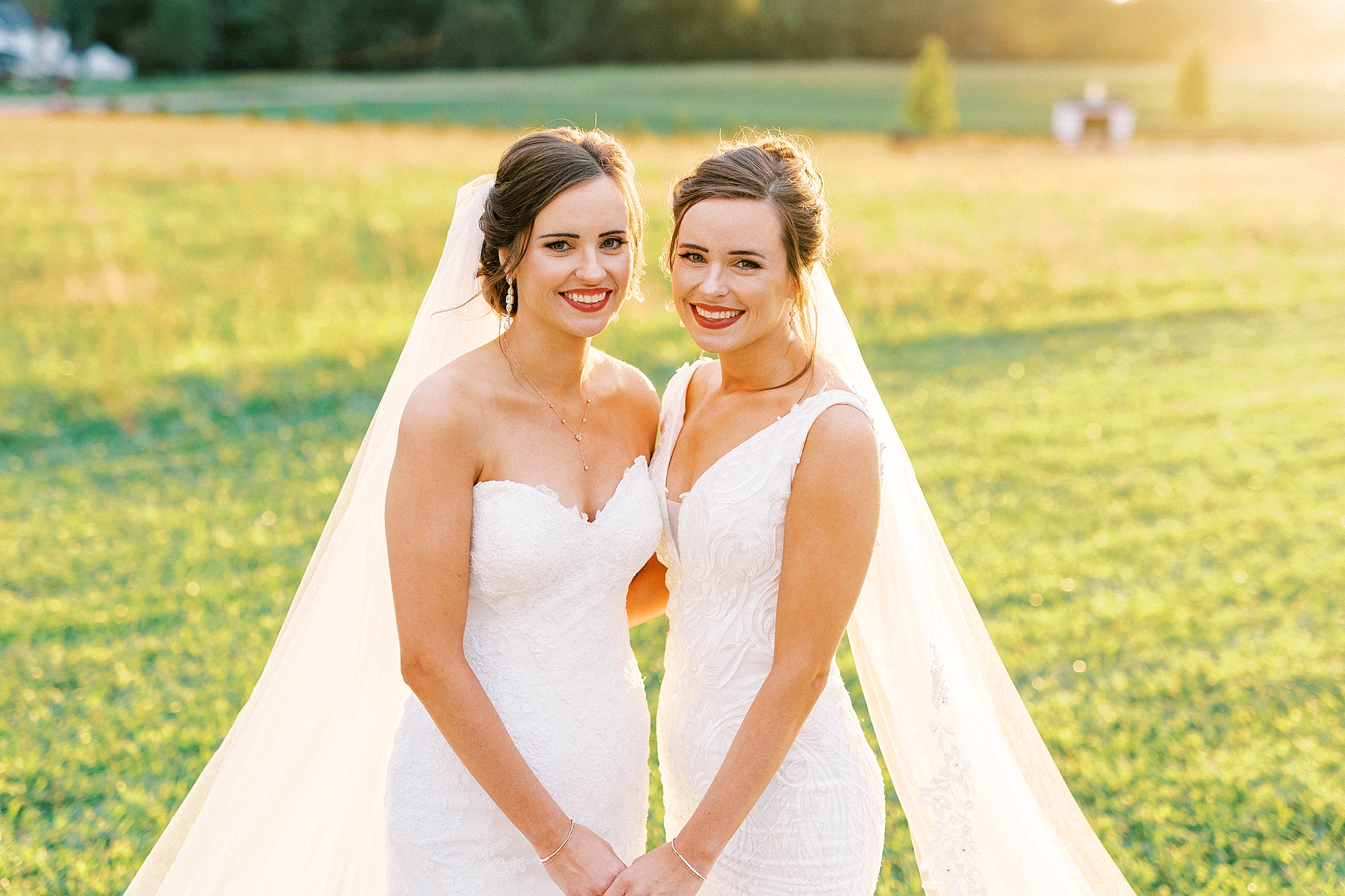bride and sister hold hands in wedding dress at Chickadee Hill Farms