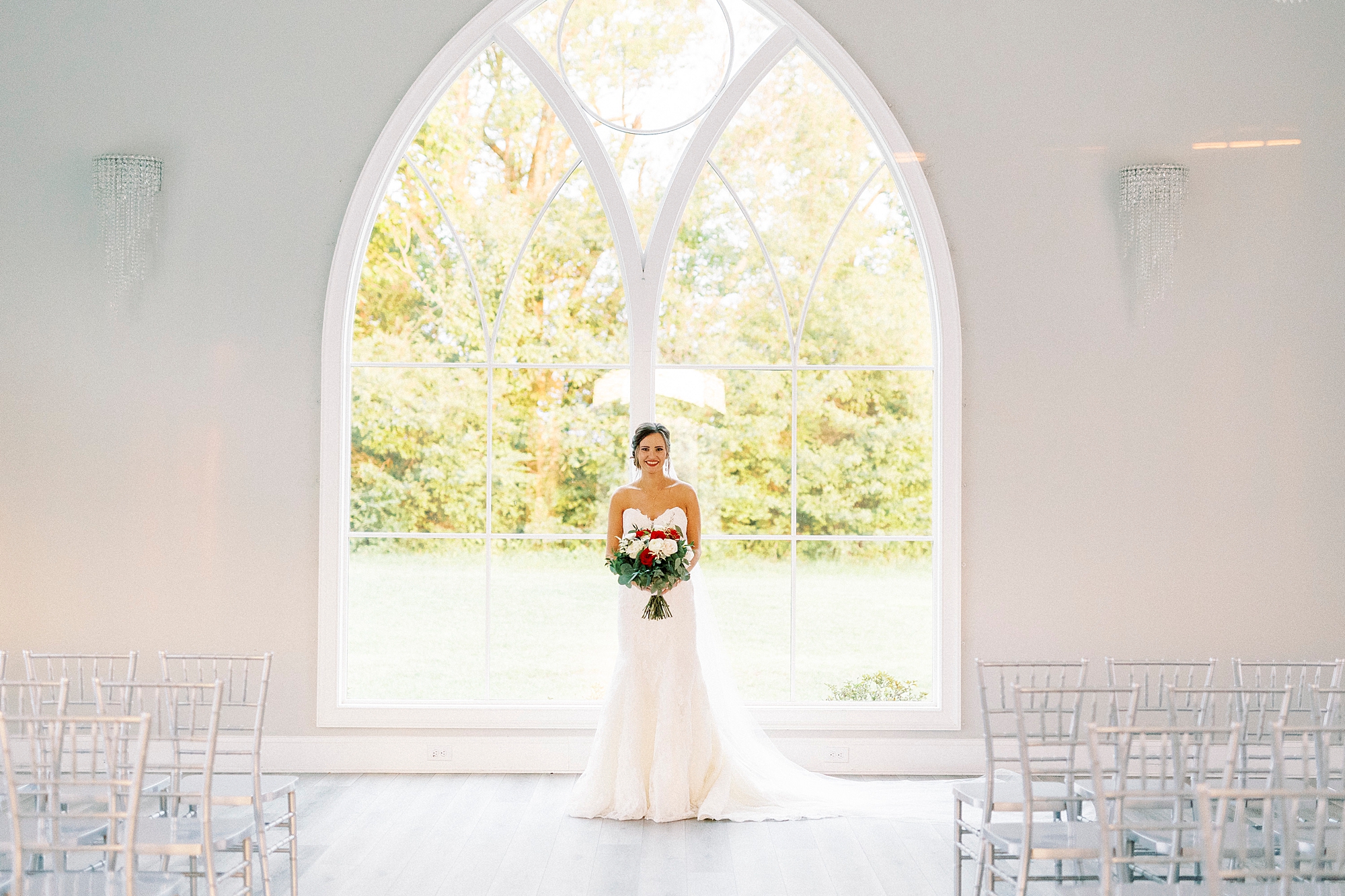 bride stands in chapel at Chickadee Hill Farms 