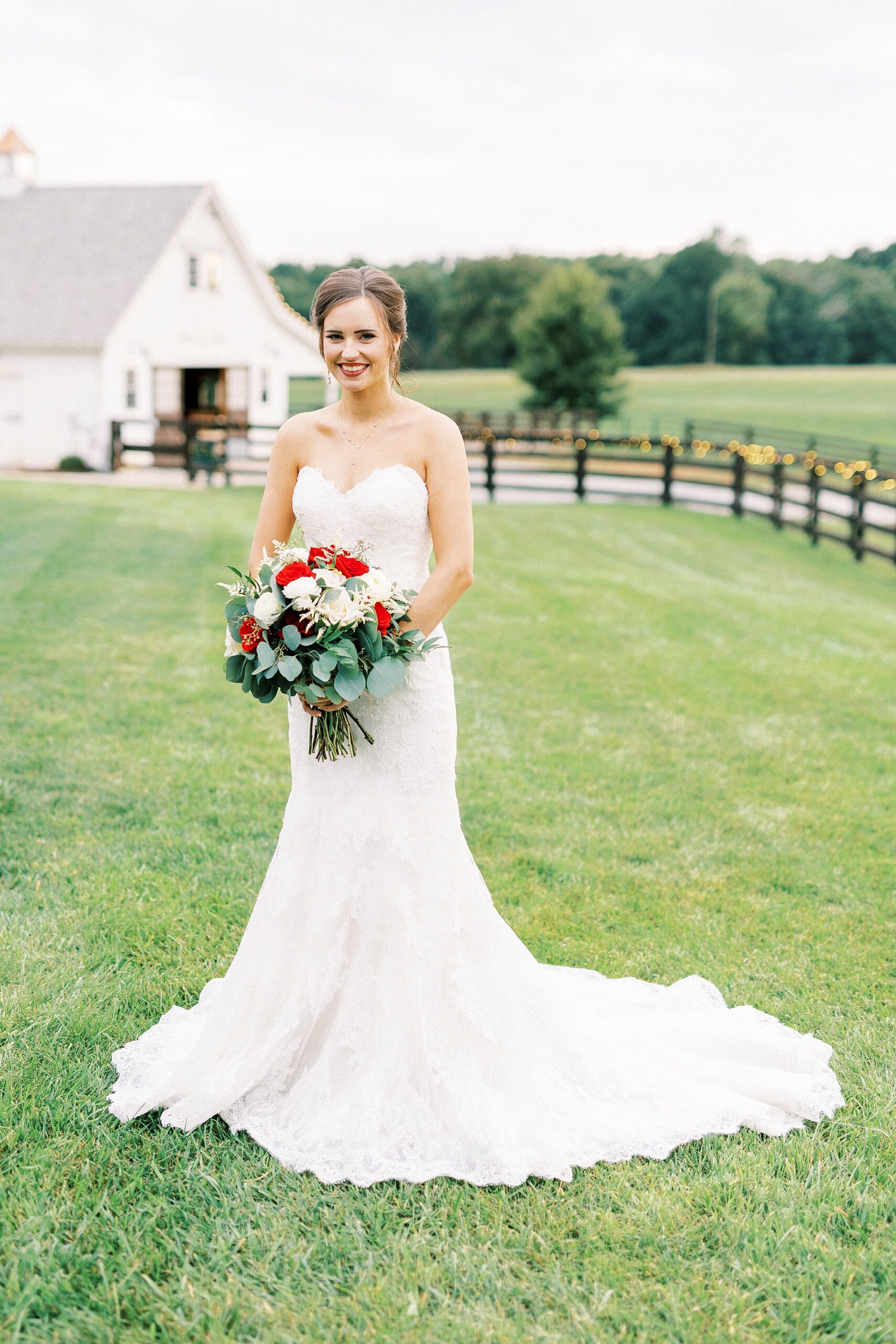 bride stands in front of chapel at Chickadee Hill Farms