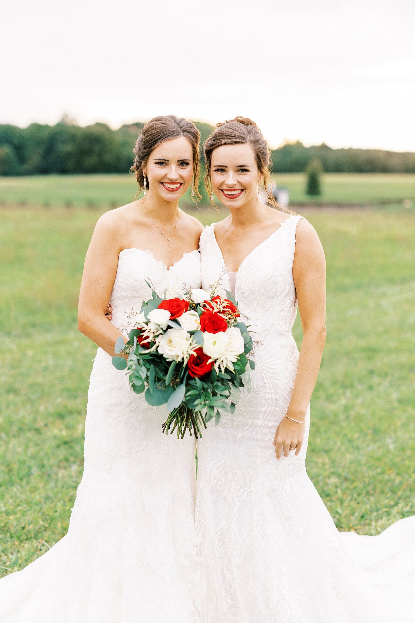 bride hugs sister in wedding gown at Chickadee Hill Farms