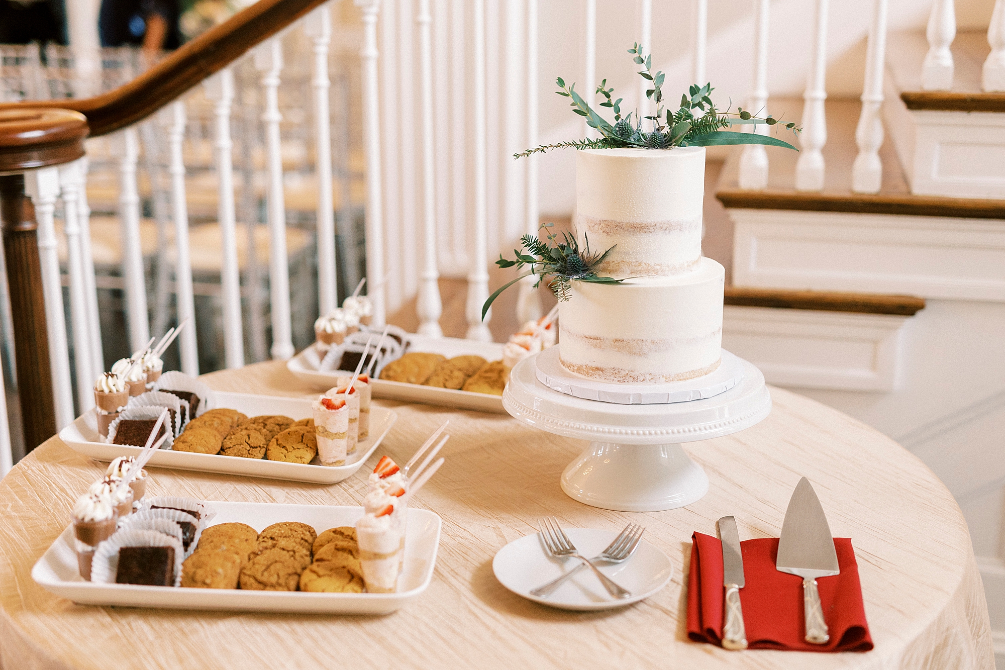 tiered wedding cake and dessert display for winter wedding reception 