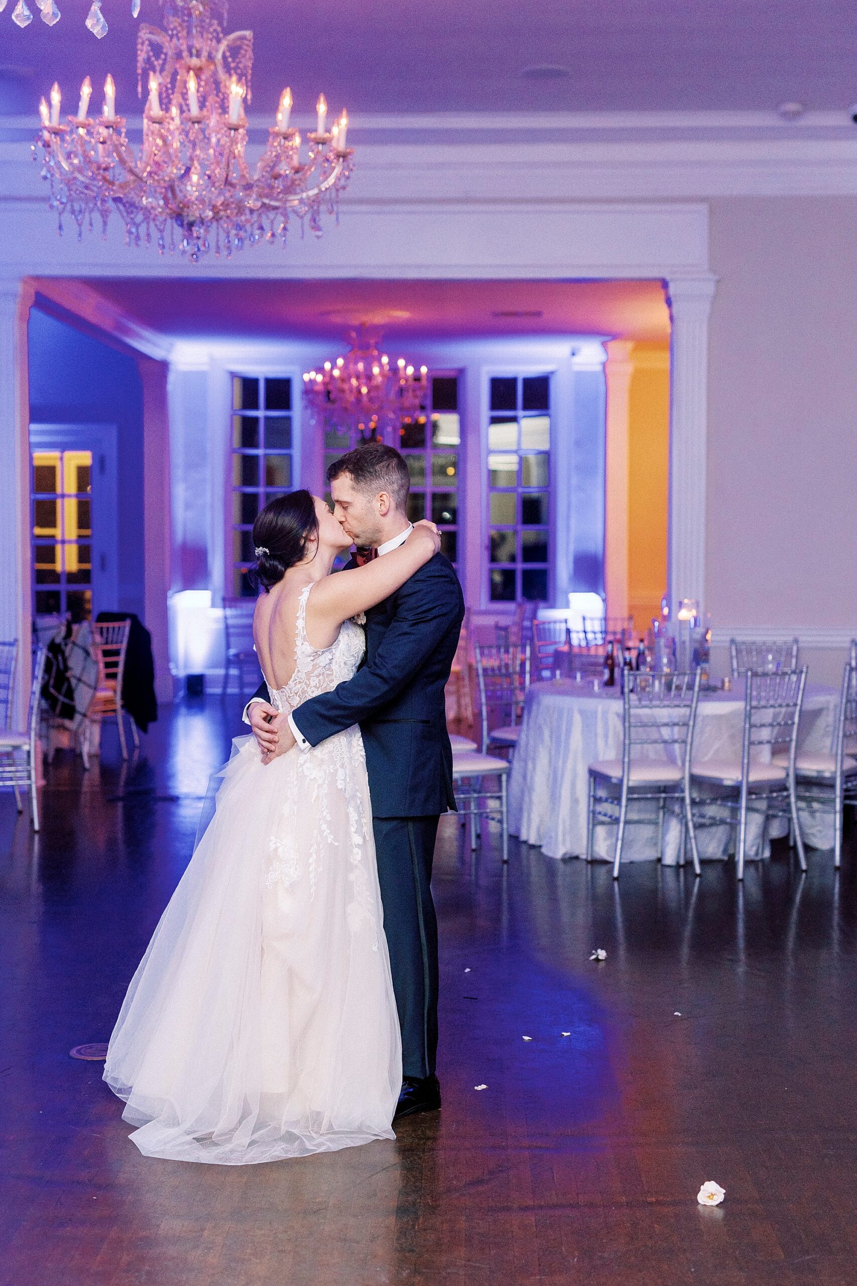 bride and groom kiss during private last dance in uplight room at Separk Mansion