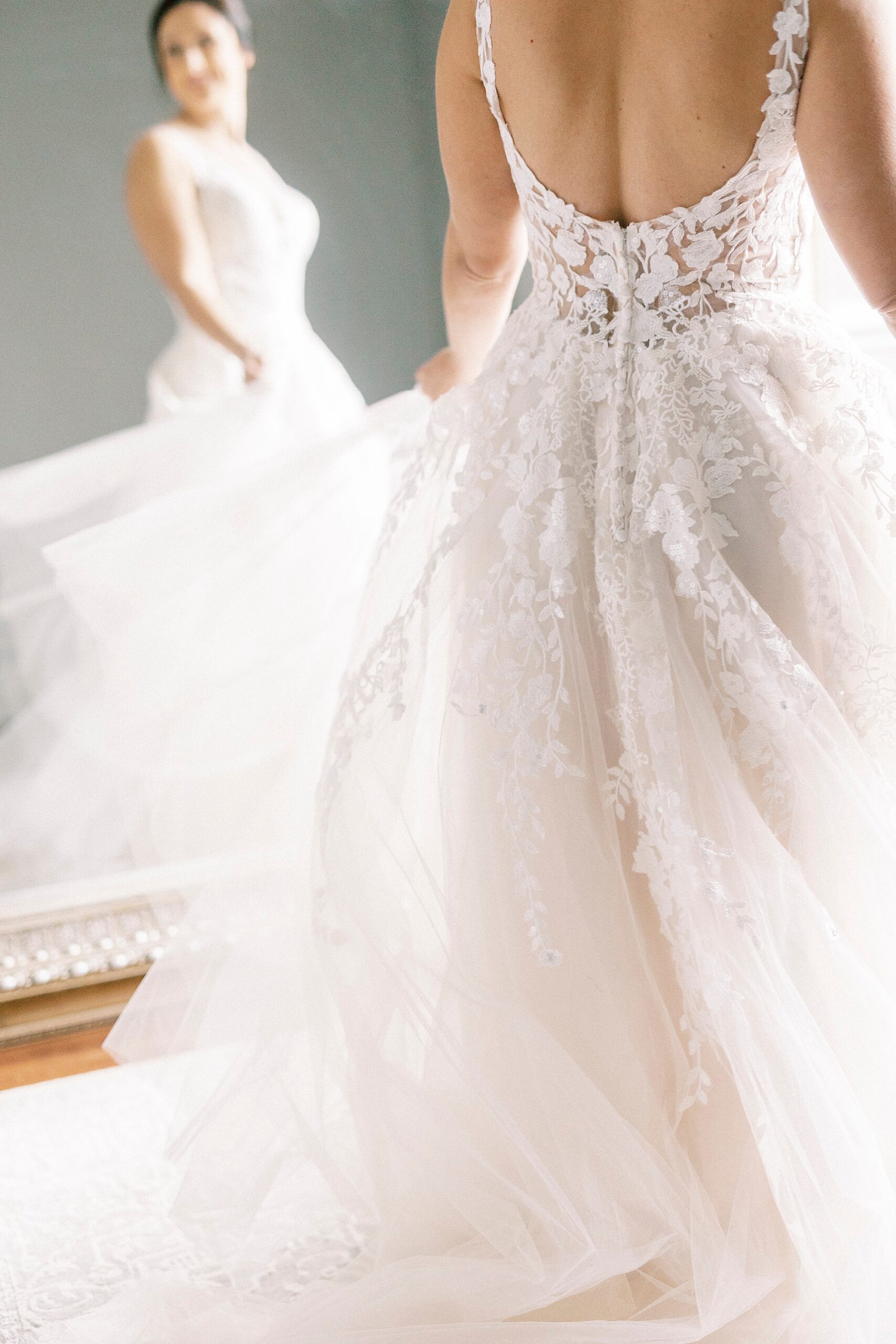 bride twirls wedding dress in front of mirror in bridal suite at Separk Mansion