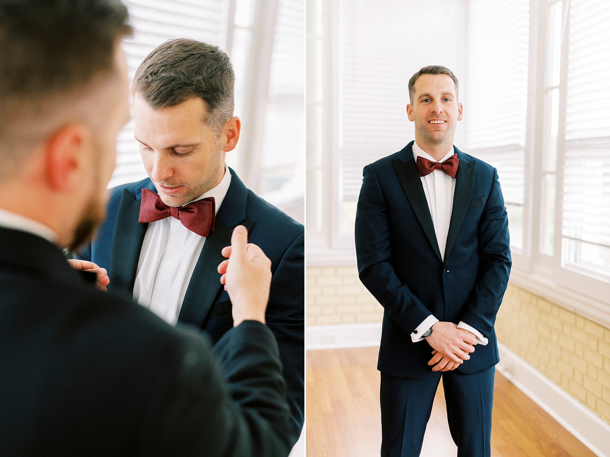 groomsman helps groom with red tie before NC wedding