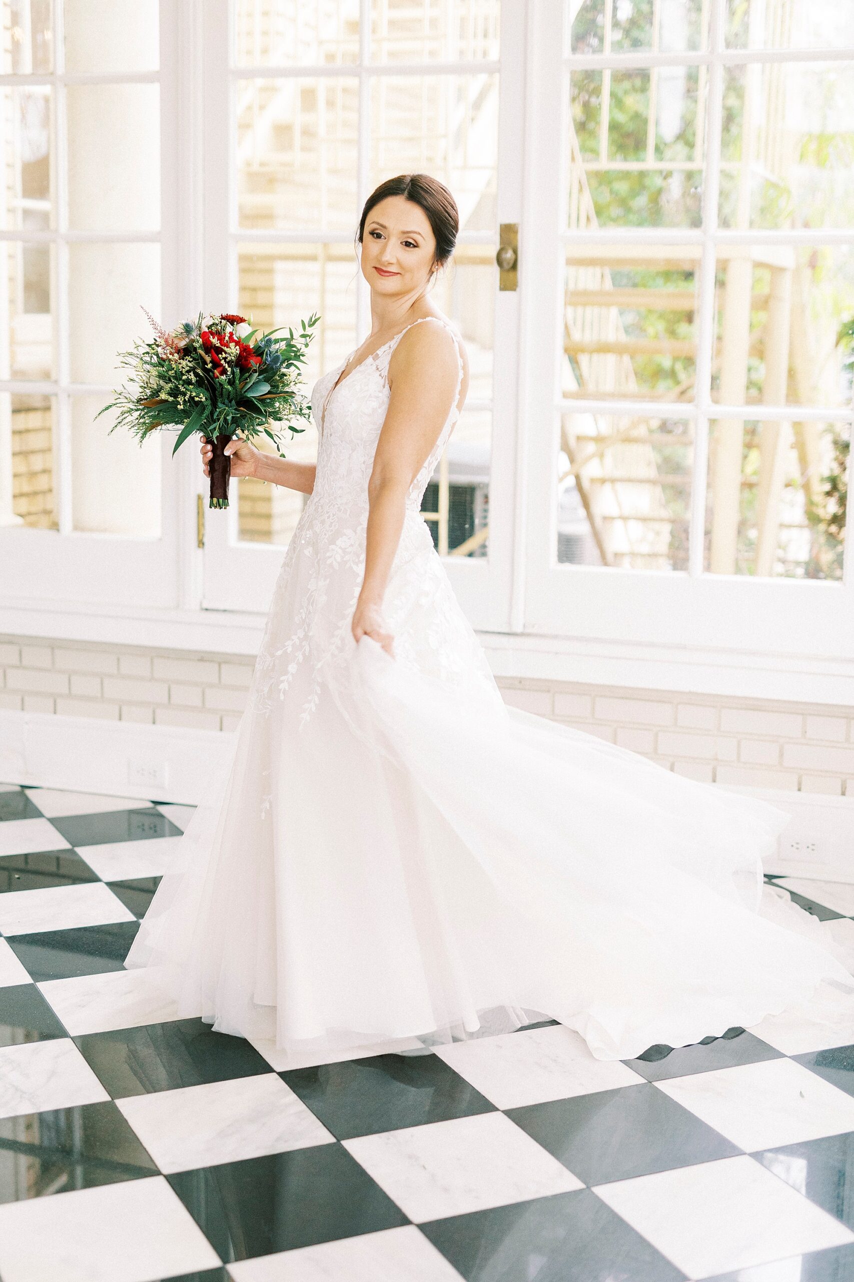 bride holds skirt of wedding dress and twirls around in Separk Mansion 