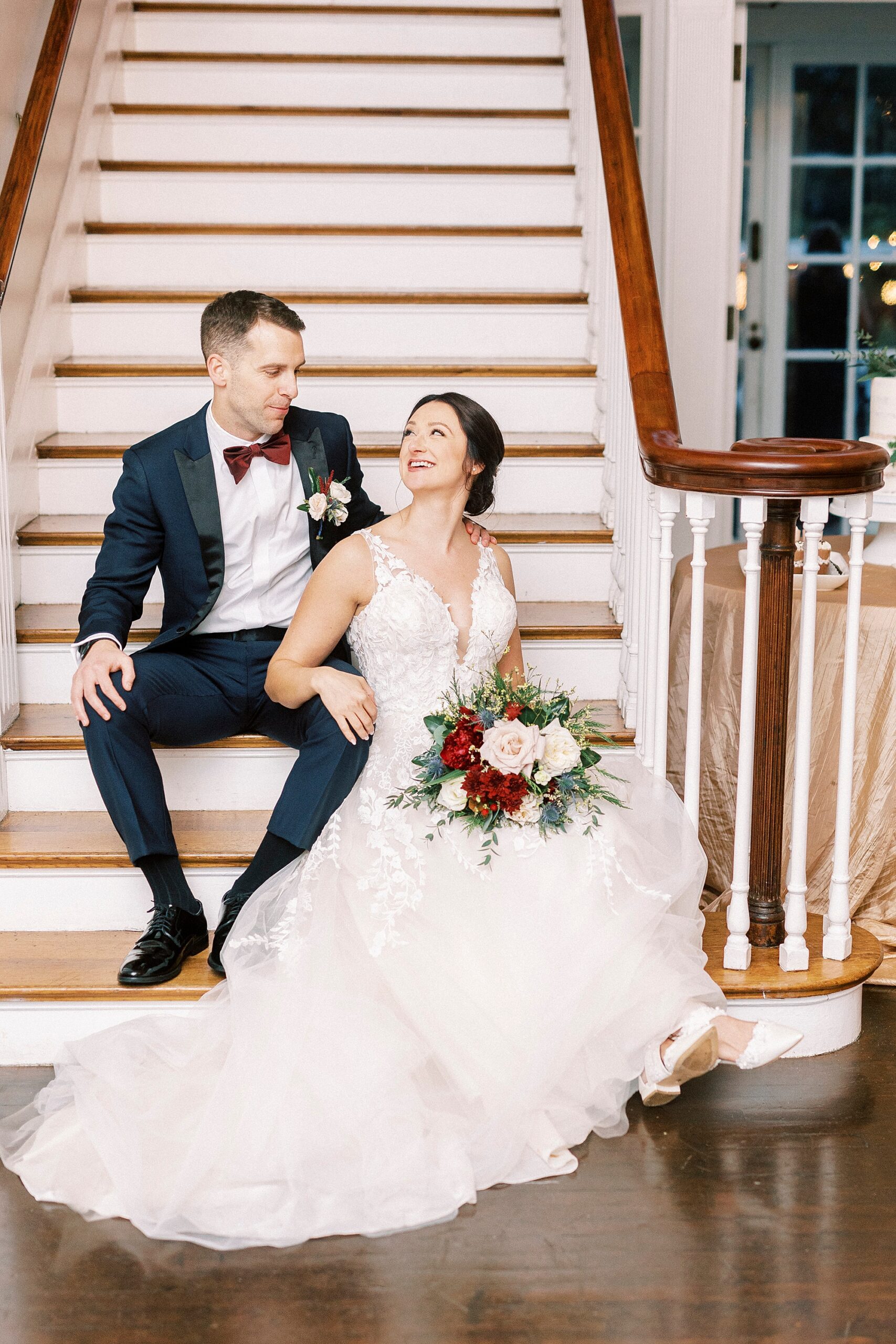 bride and groom sit on staircase inside Separk Mansion