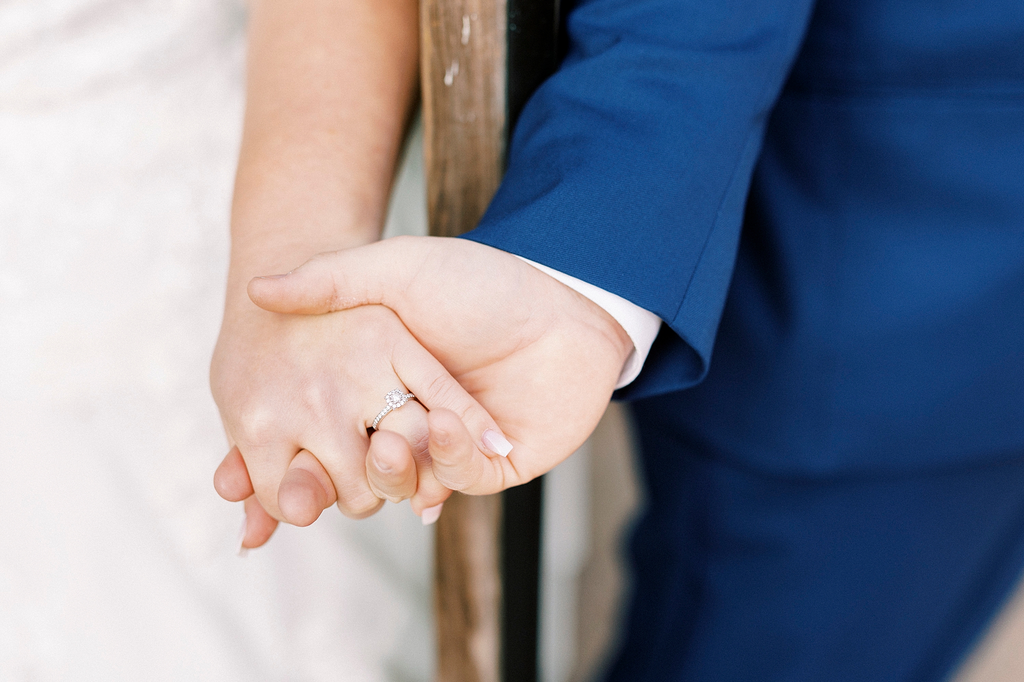 bride and groom hold hands during fall wedding day at the Farm at Brusharbor