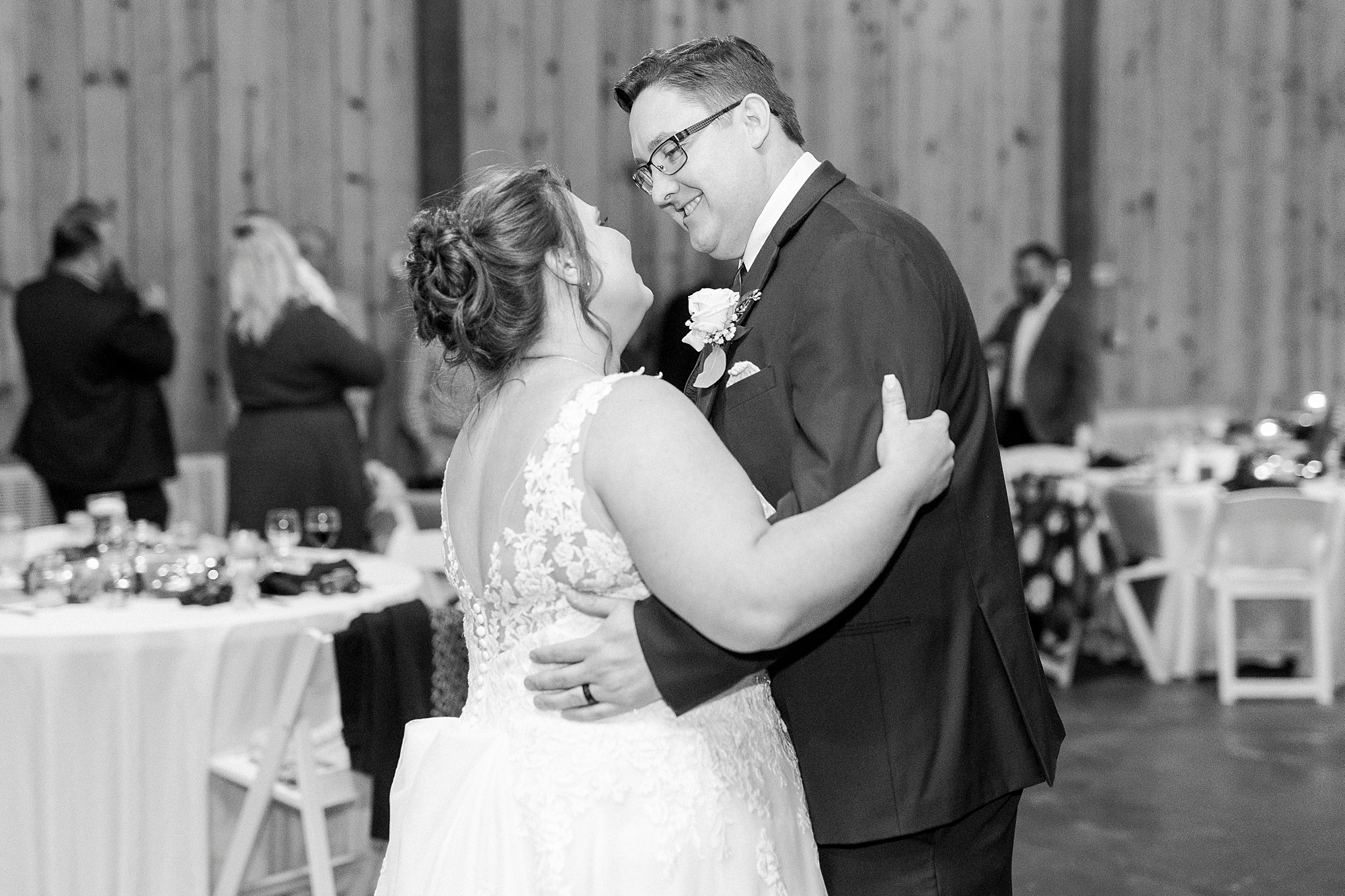 newlyweds have first dance in barn at the Farm at Brusharbor