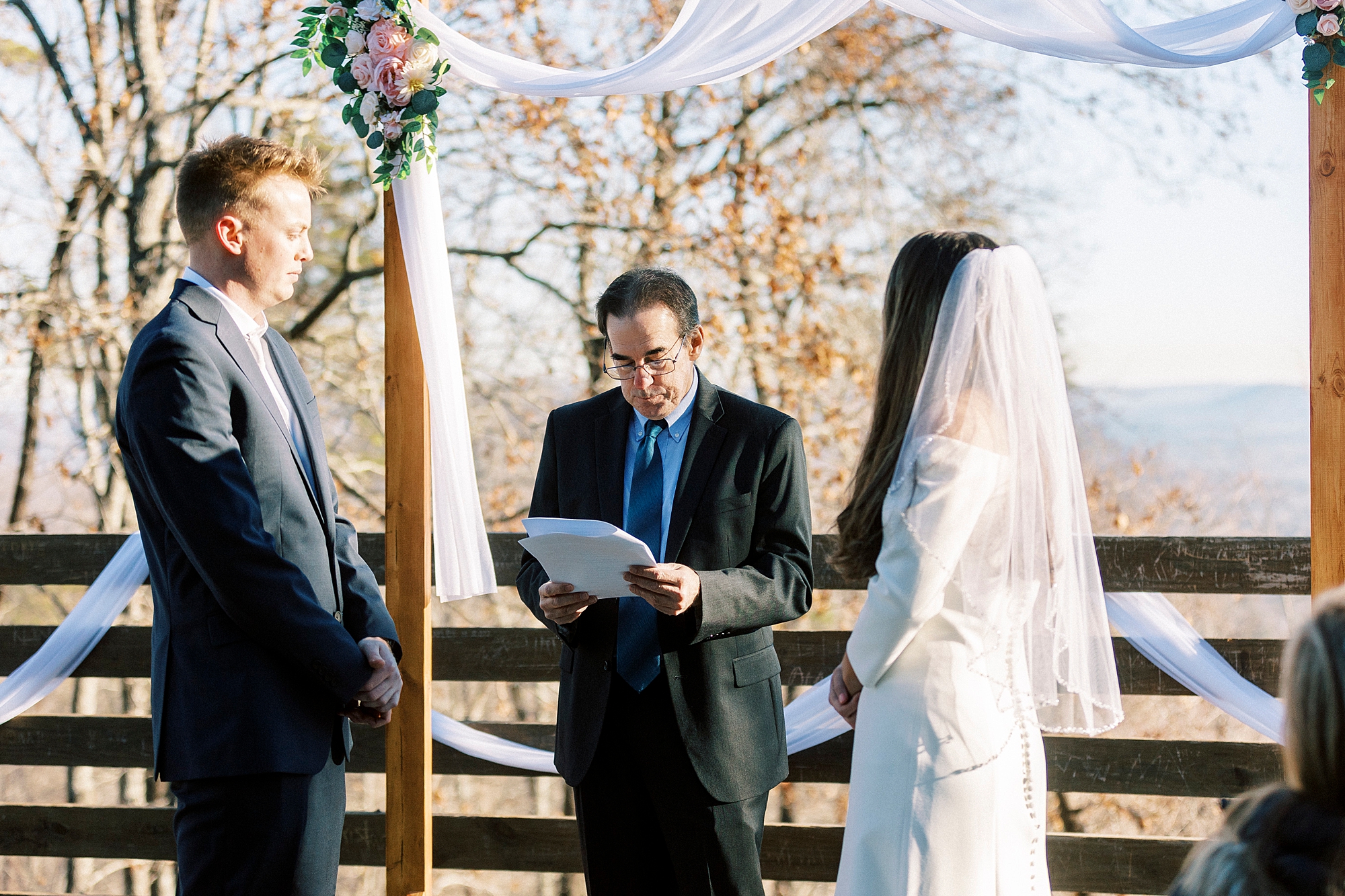 bride and groom exchange vows during ceremony at Morrow Mountain