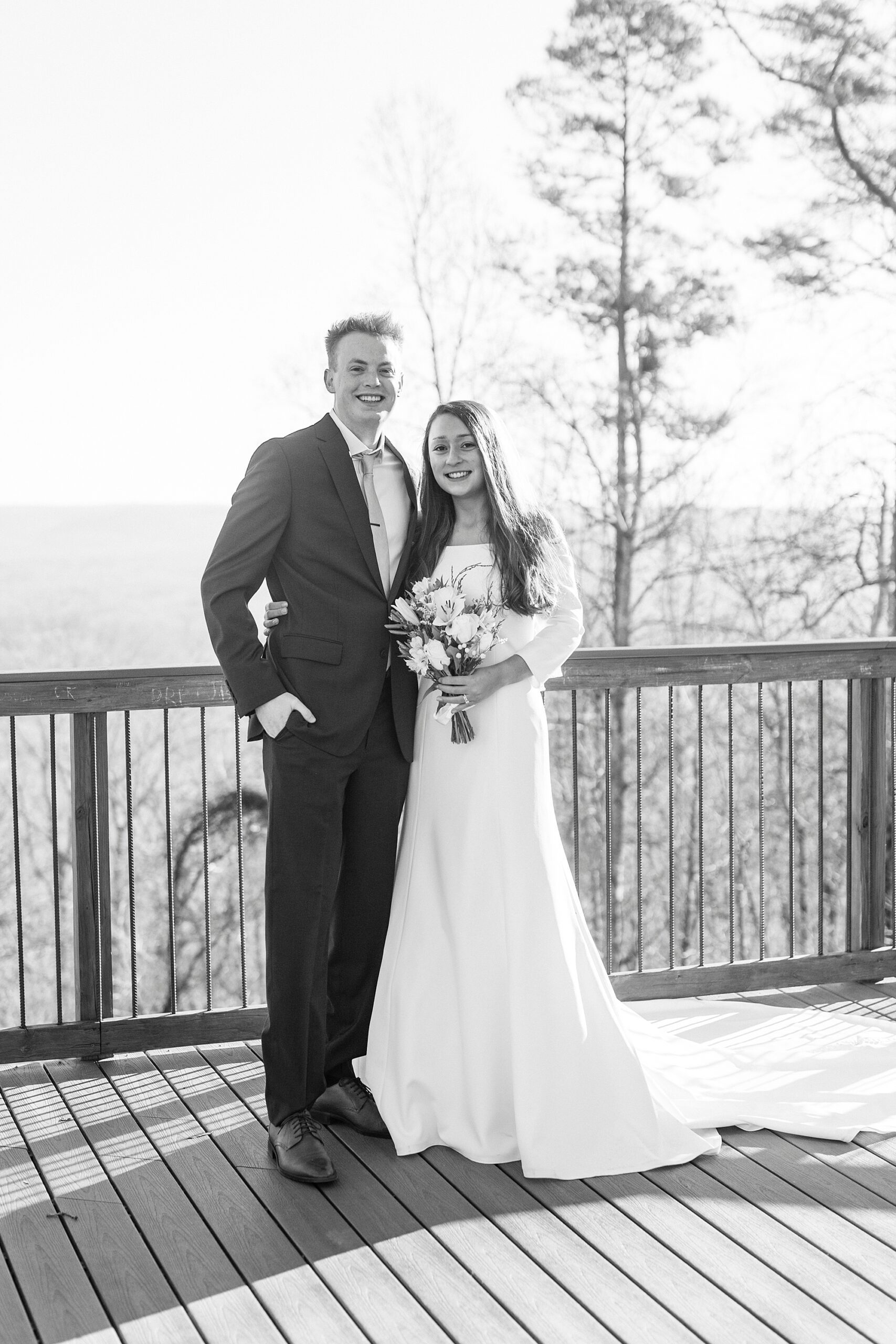 bride and groom hug each other on top of Morrow Mountain