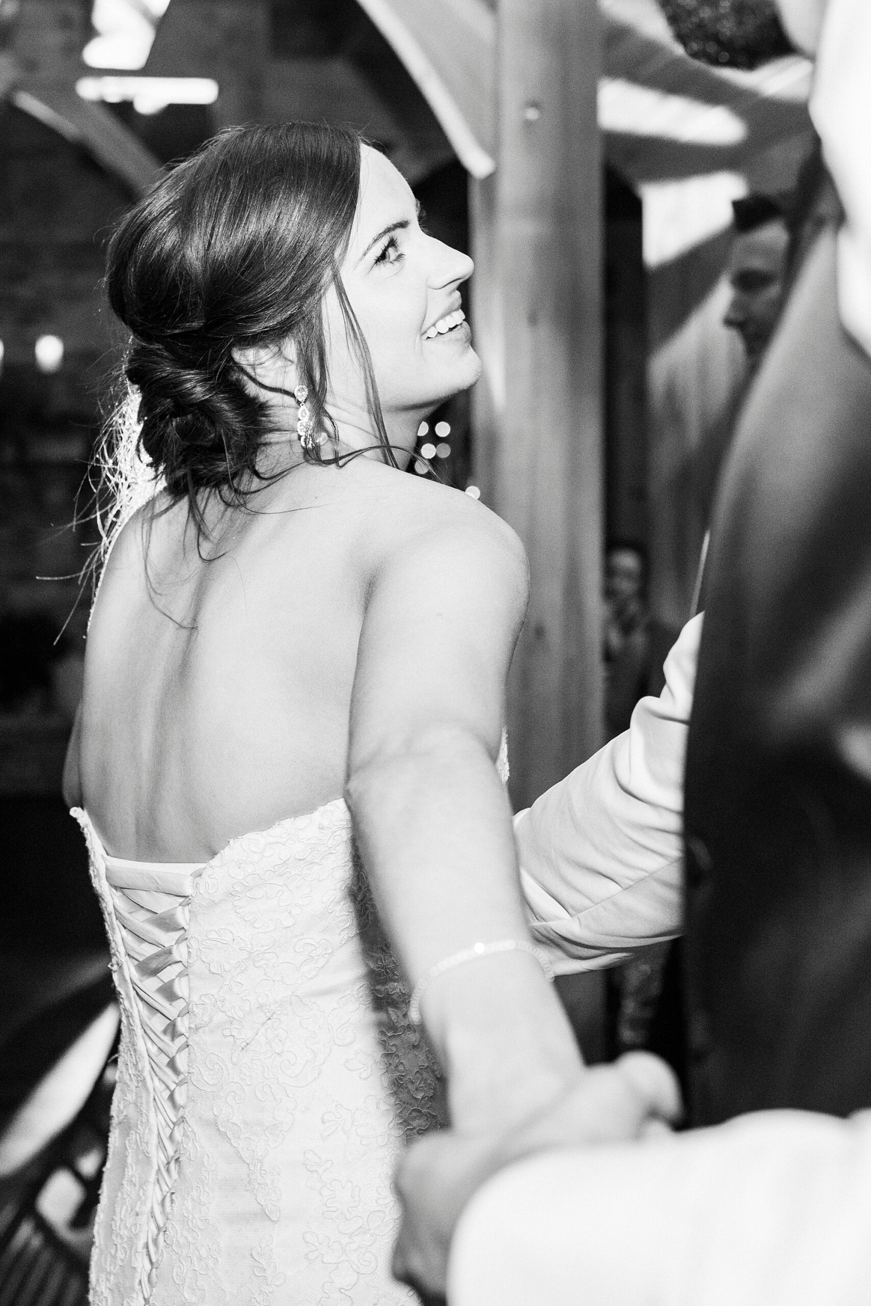 bride smiles up at groom during Statesville NC wedding reception 