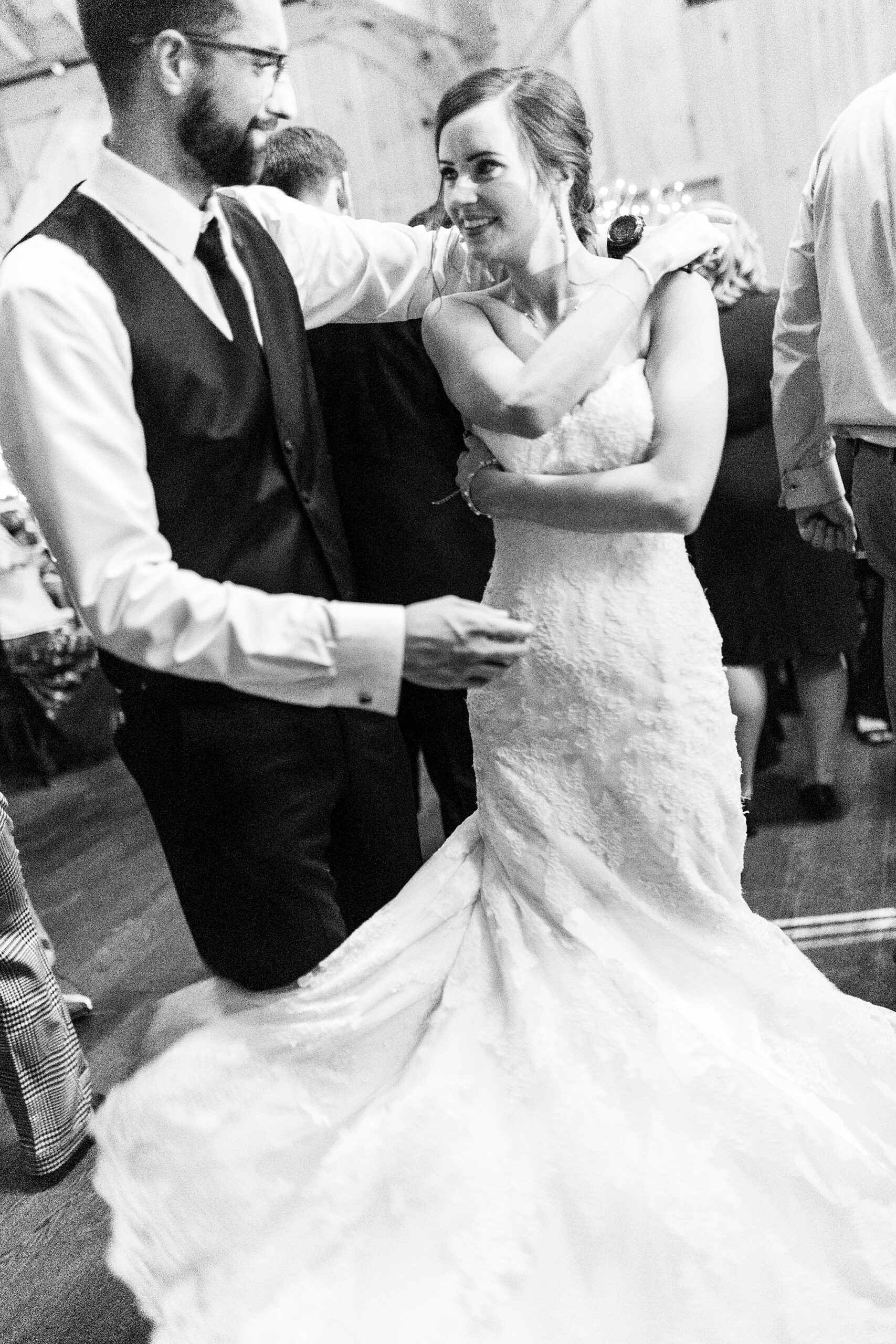 groom twirls bride during Statesville NC wedding reception 