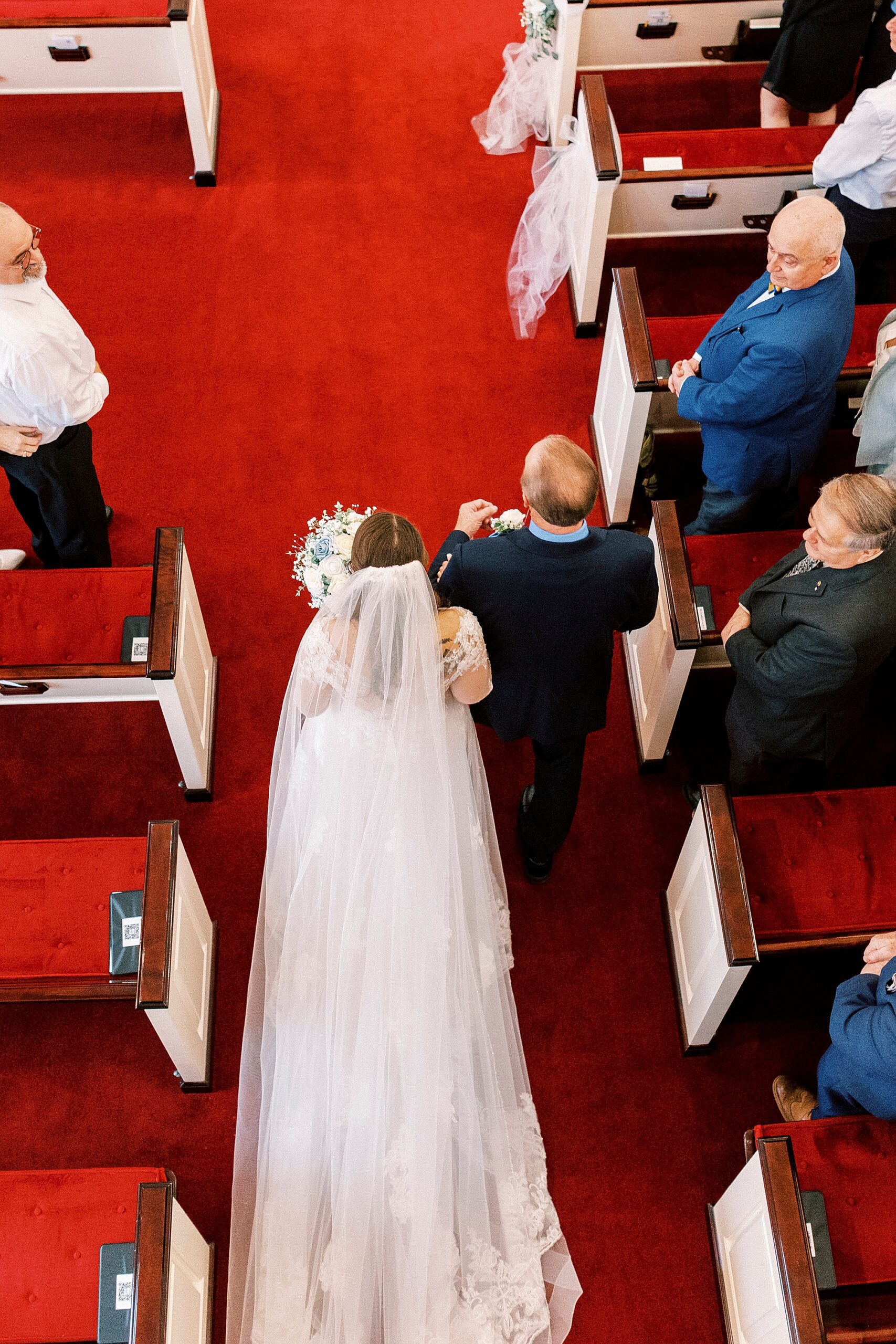 photo from above as bride walks down aisle inside First Baptist Church in Kannapolis NC
