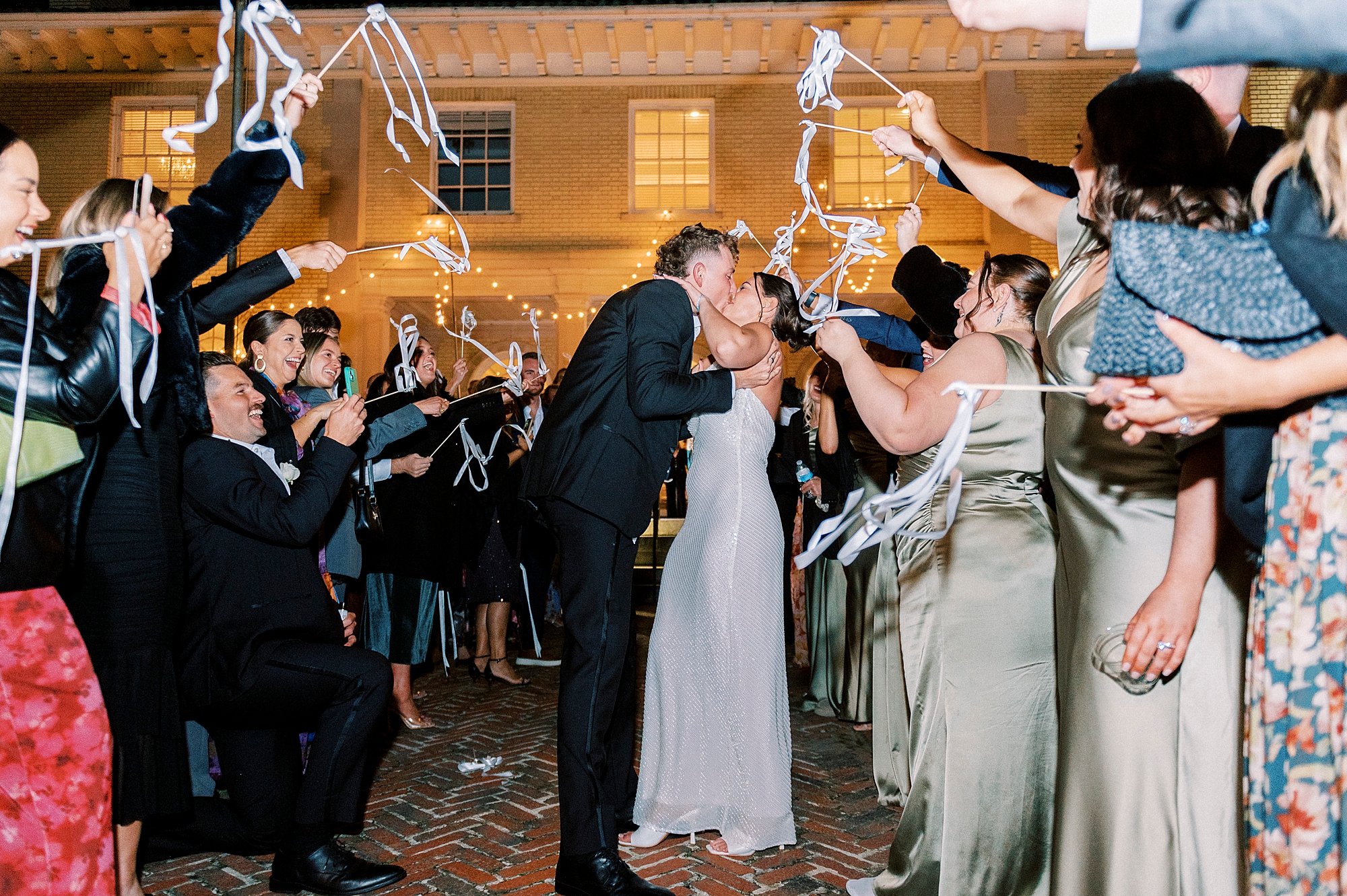newlyweds kiss during exit from Separk Mansion