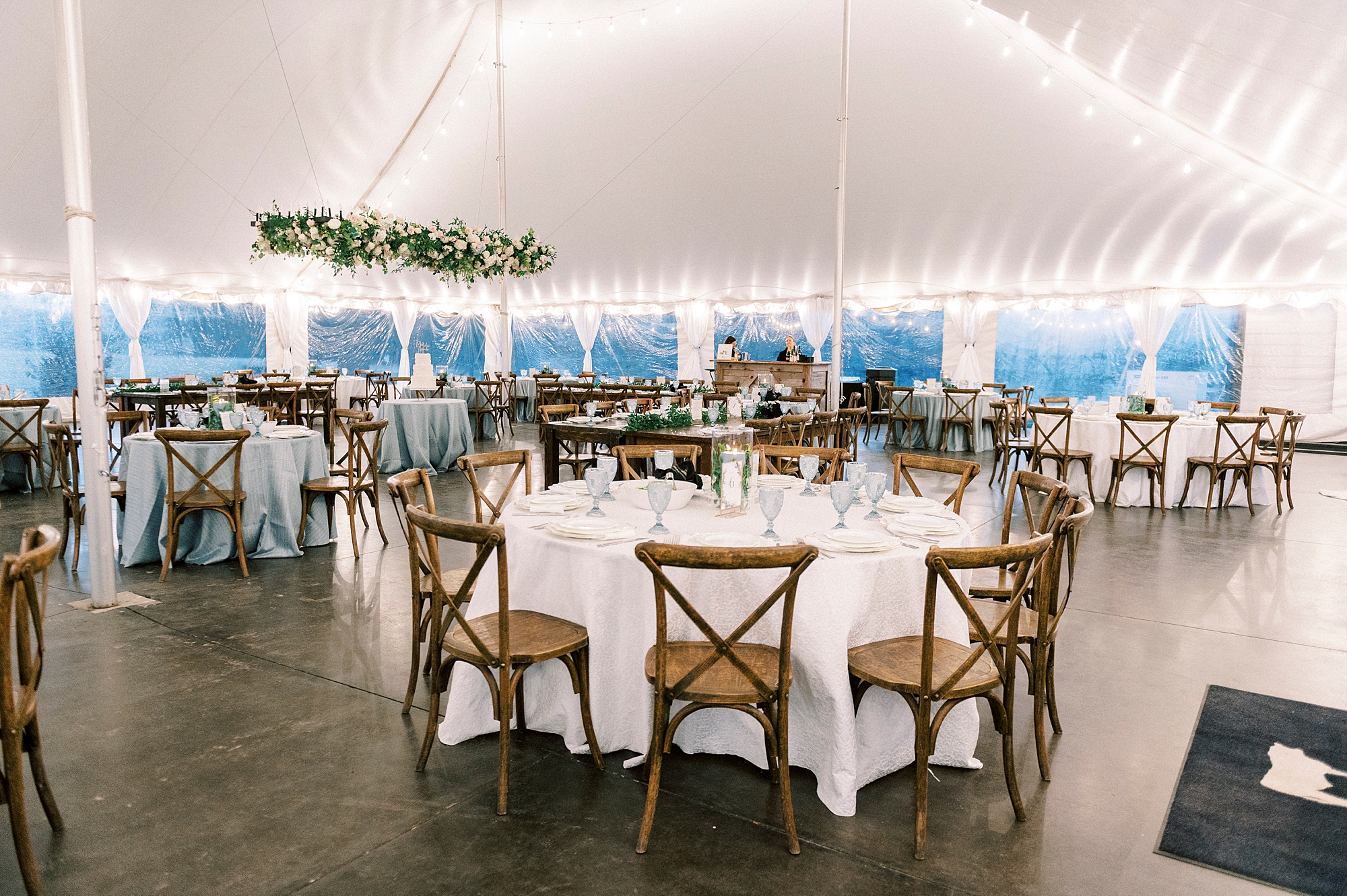 tented wedding reception with blue and white details at Summerfield Farms