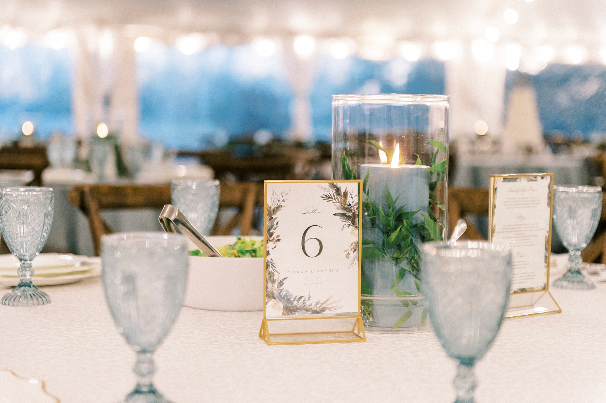 tablescape with vintage blue glasses and table numbers for winter wedding reception at Summerfield Farms